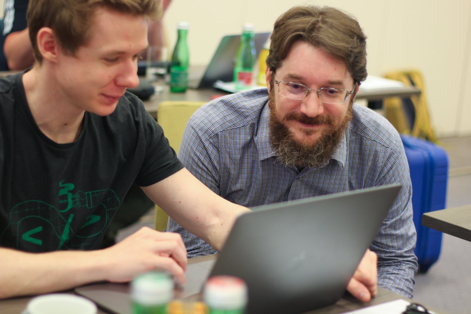 Markus and Balazs hacking away in front of a laptop at the LKWW Hackathon