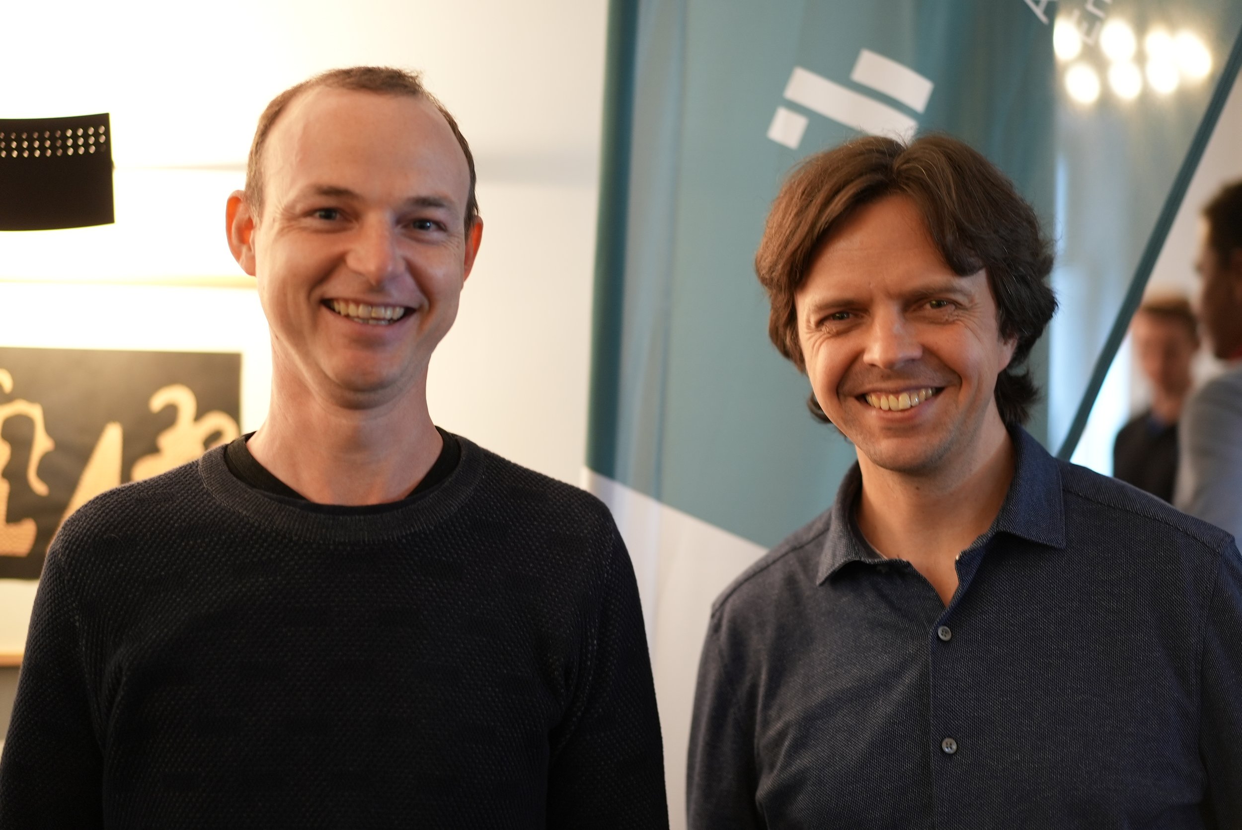 CEO Jörg and Vadim smiling at the camera during a company get-together