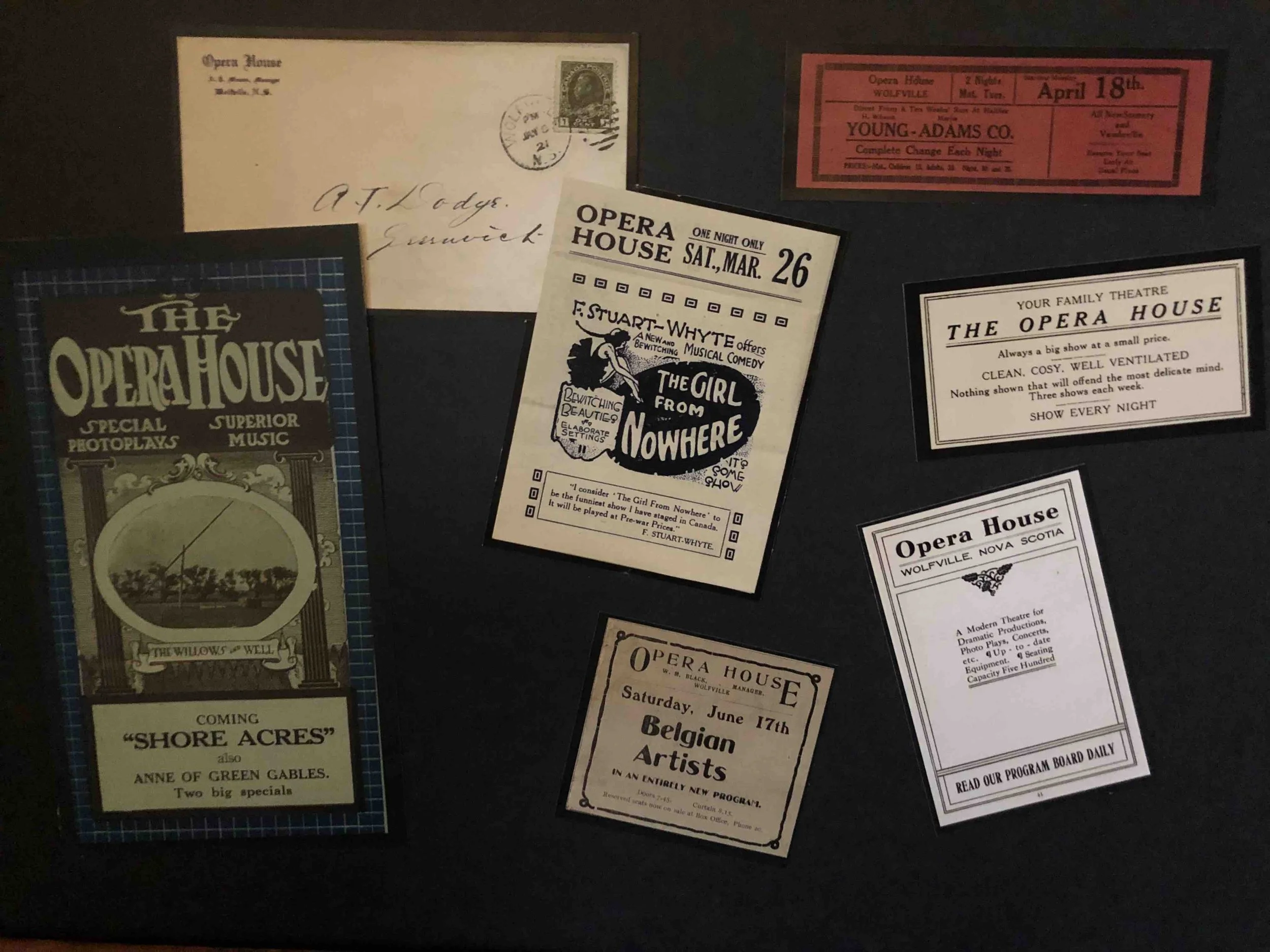Collection of vintage Playbills and tickets for The Opera House, including advertisements for performances by Belgian Artists and other shows at the Opera House in Wolfville, Nova Scotia.