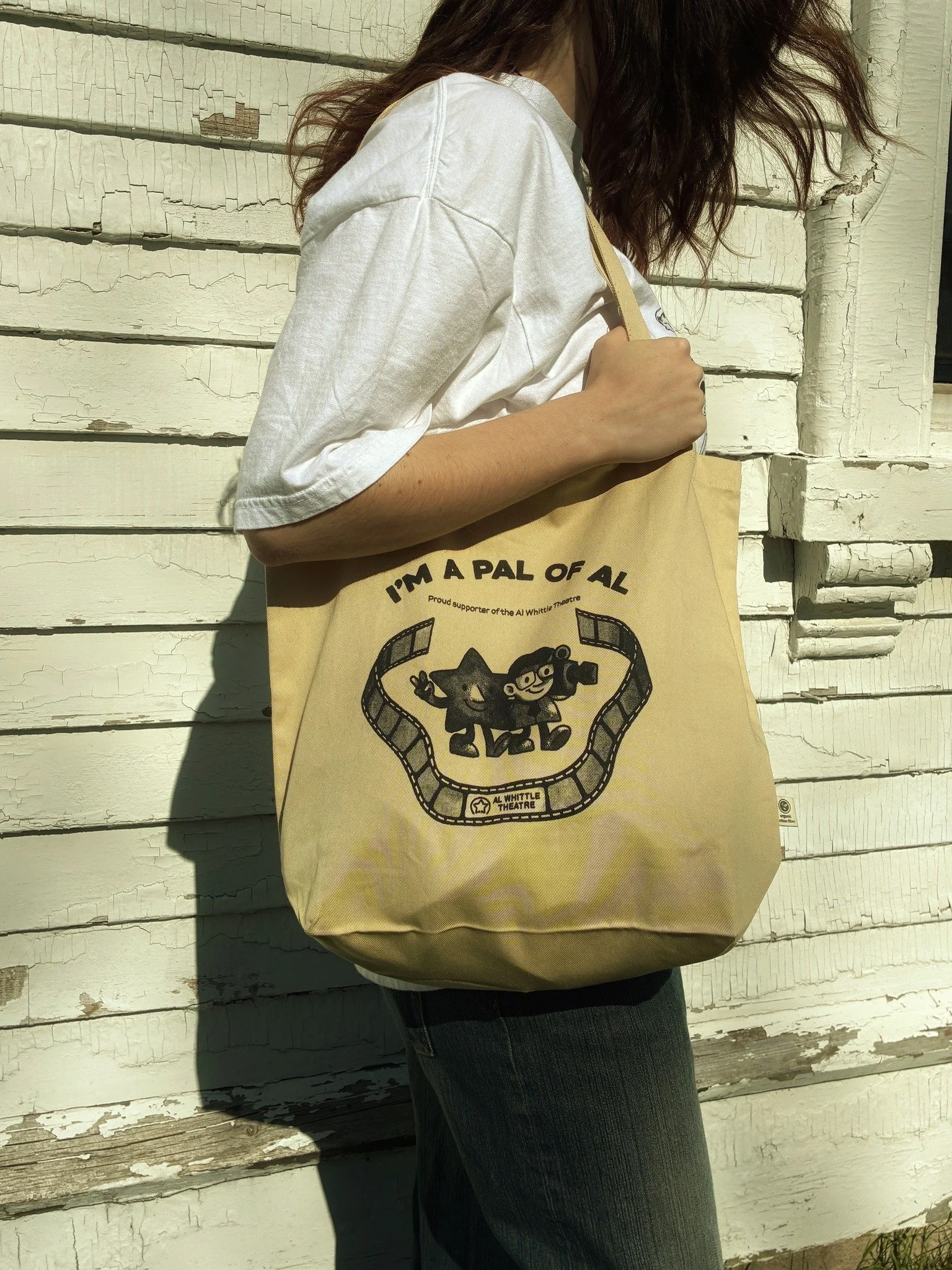 We have merch stock available! 🌟

No pre-order required - we're excited to announce that we have shirts, totes, pins, prints, cards, and a limited supply of toques available for purchase at the box office or on our website. Supporting independent ci