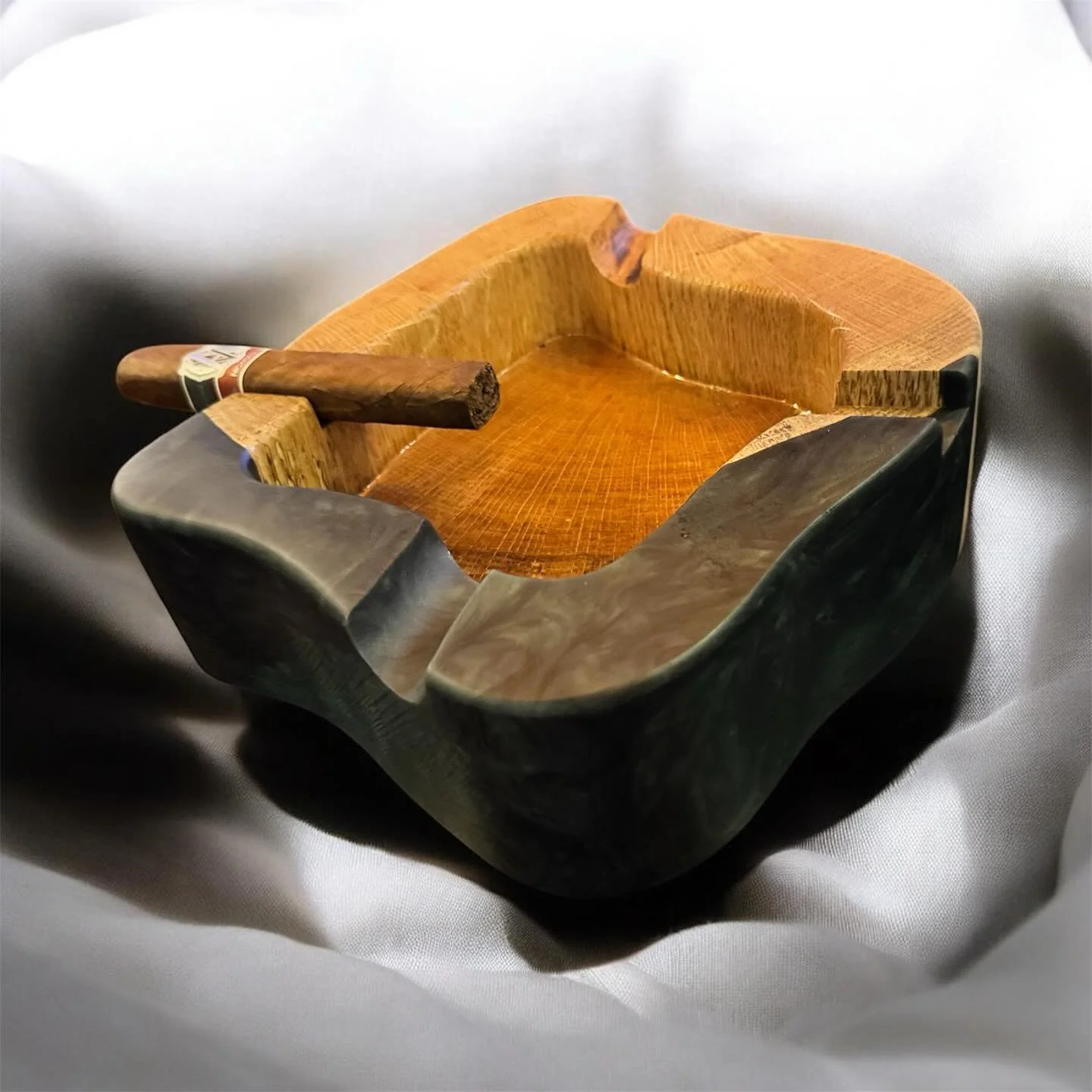 Red Oak ashtray with bonsai green and yoru black epoxy &mdash; designed to stand out. The epoxy edge adds a bold, elevated look, and each one is carefully routed to create a one-of-a-kind piece that brings character to any home lounge.