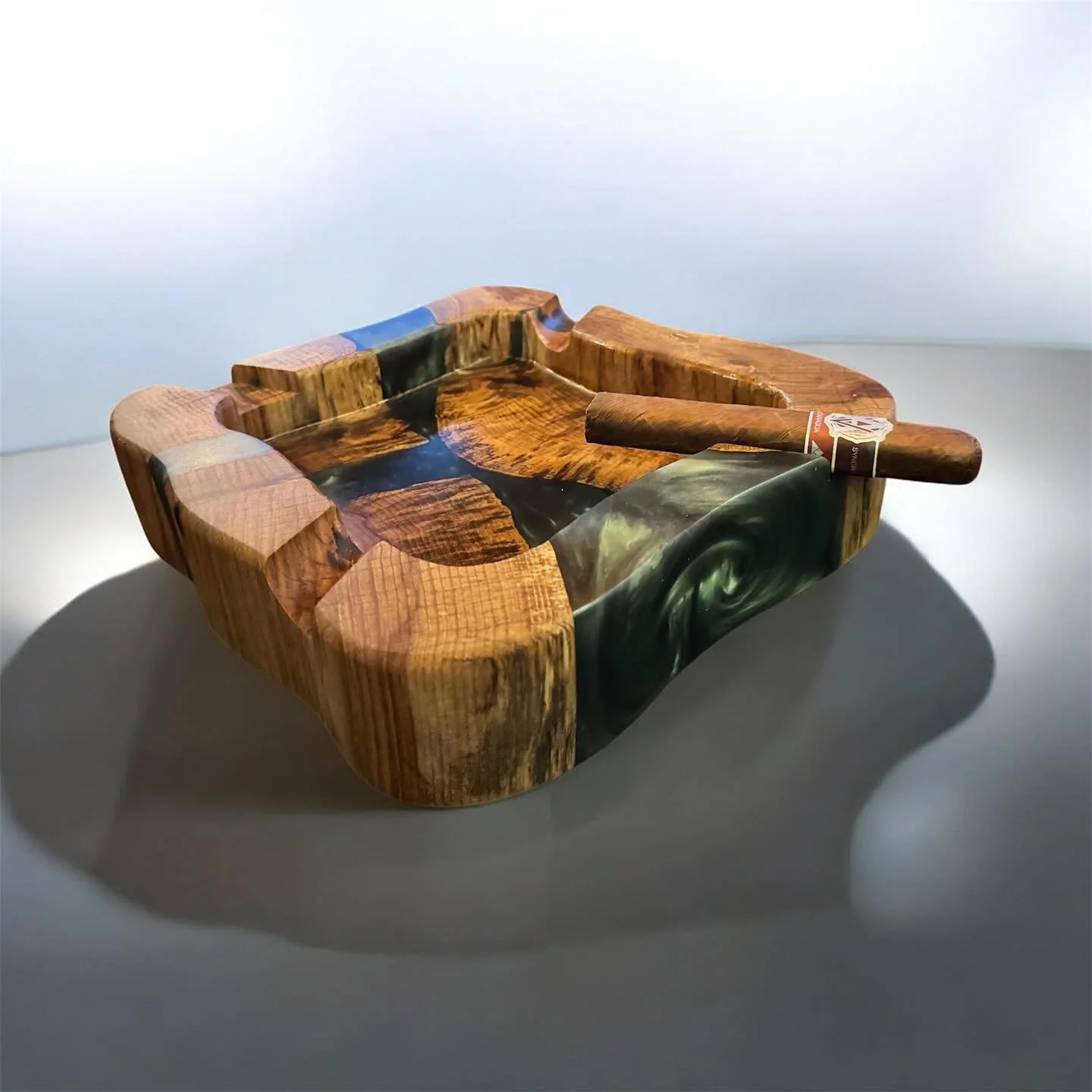 This ashtray was carved from live edge hickory and poured with Lets Resin deep-pour epoxy, featuring a stunning Bonsai Green pigment from Eye Candy Pigments. The natural spalting in the wood takes it to another level &mdash; a true conversation piece