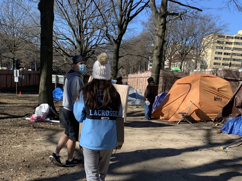  Delivering “Winter Warm Kits” to a homeless encampment in Washington, D.C. in 2020. 