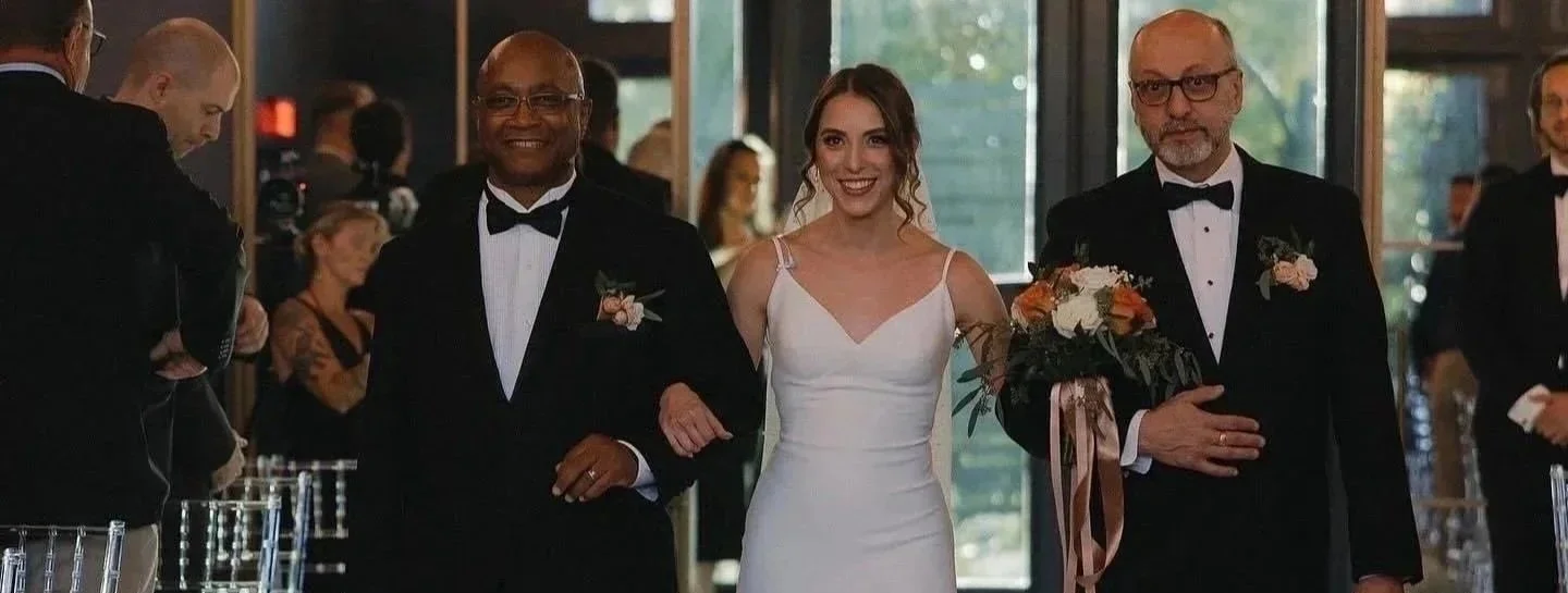 Laurie’s customers, Evan and Kade, running down a mountain after getting married. 