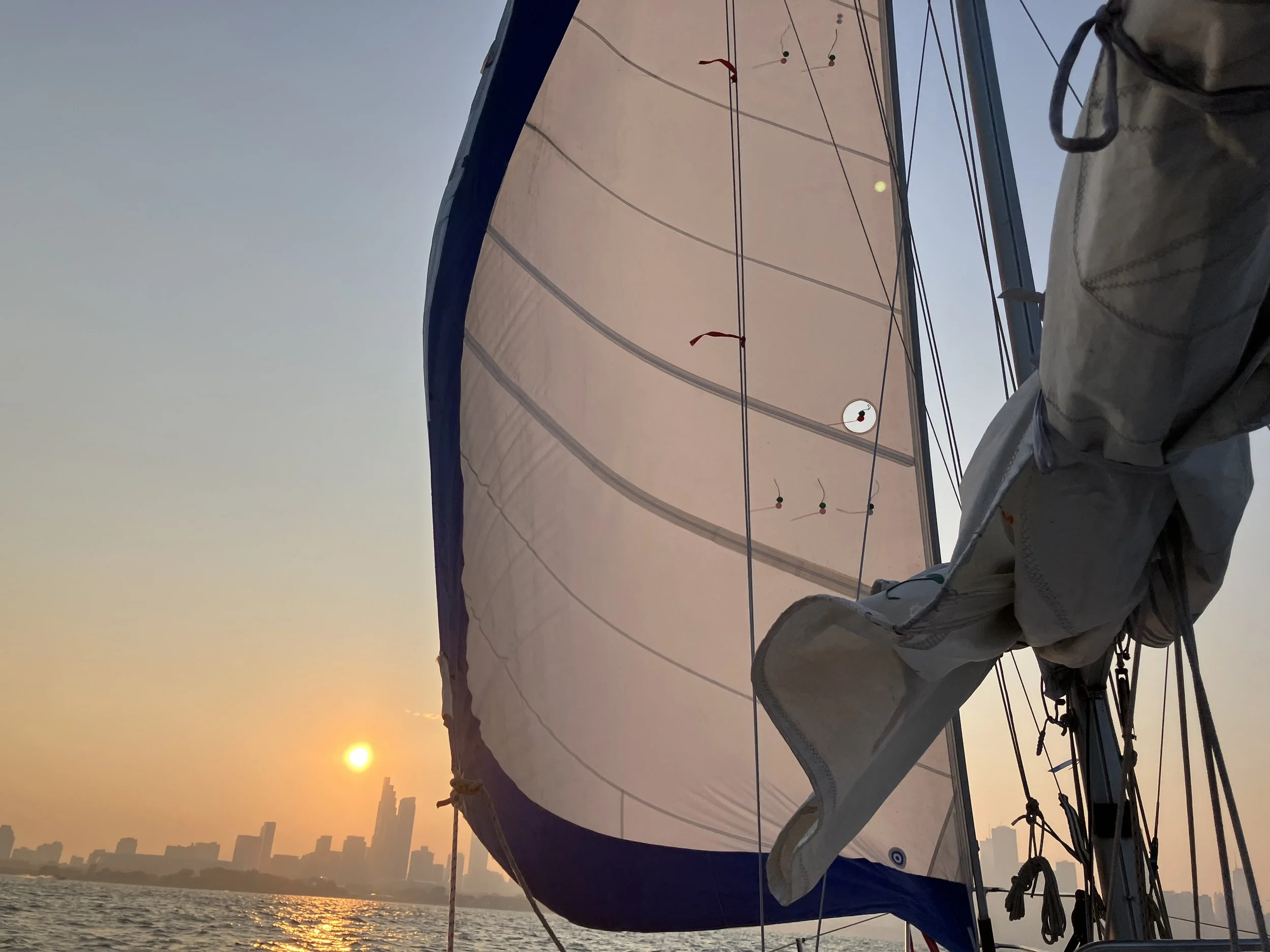 a sailboat at sunset