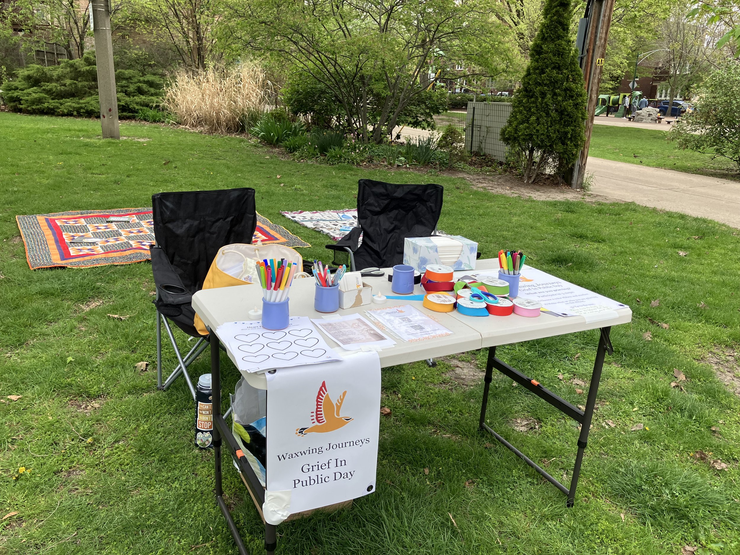 Table in a park with art supplies