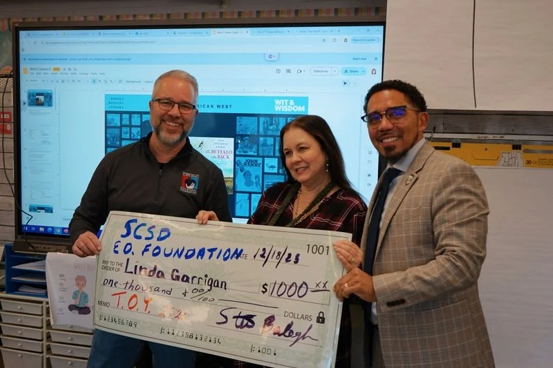 Photo op with giant check presented to Linda Garrigan from the SCSDEF