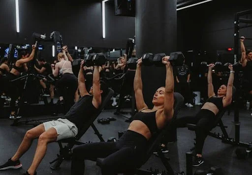 How Group Strength Training Builds Muscle, Community, and Confidence
