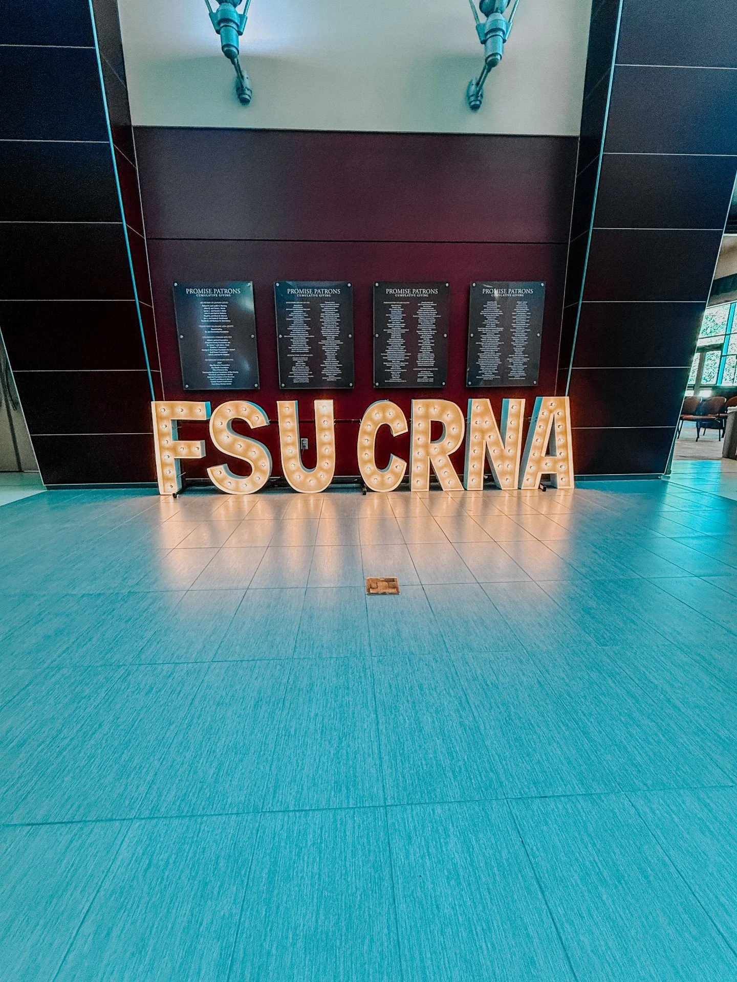 This marquee setup instantly transformed the room into a full photo moment while still keeping the overall feel polished and professional.

One thing we love about corporate installs is finding the balance between branding and atmosphere. Guests shou