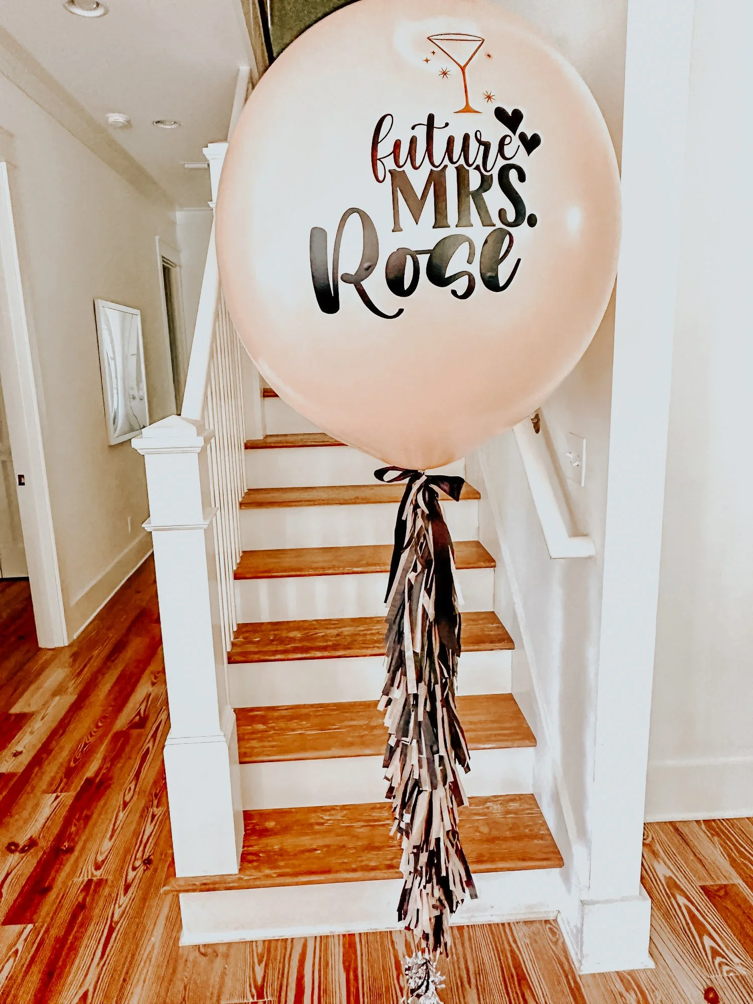 Custom giant pink balloon with tassel ribbon and “future MRS. Rose” lettering styled for a 30A bachelorette or bridal celebration.