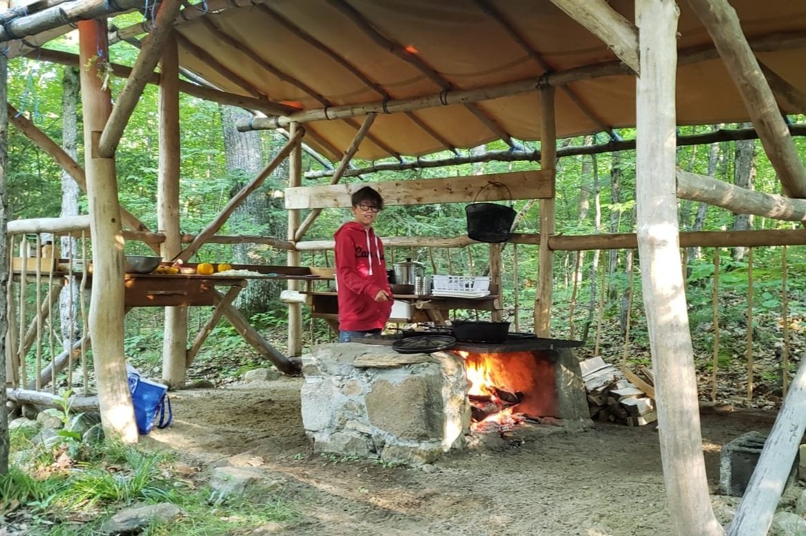 4_boy+cooking+at+Crane+Lake+Discovery+Camp.jpg