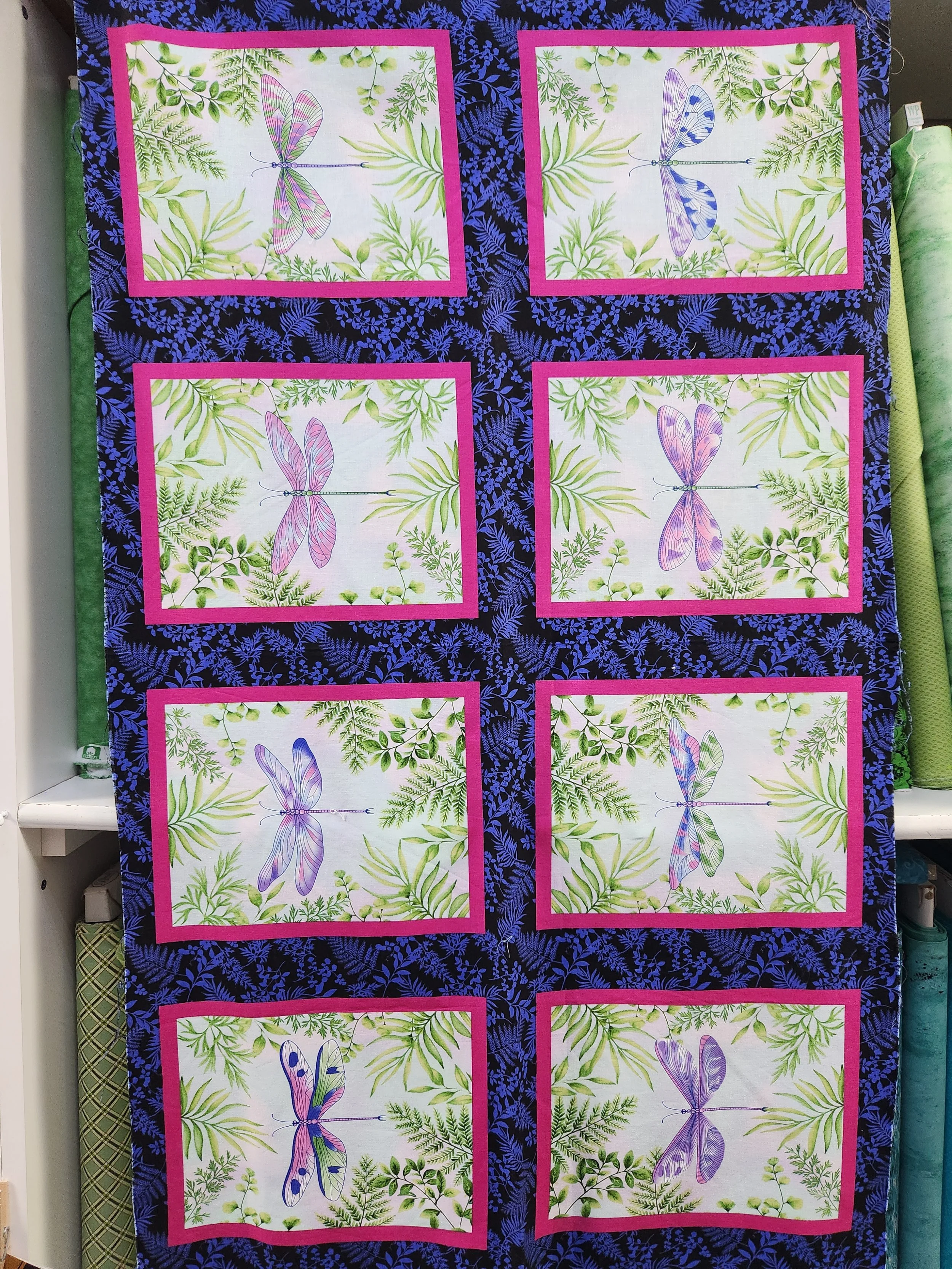 Henryglass company Dragonfly Garden 2460-77  Small 8 x 10 inch squares framed by a black and royal blue background.