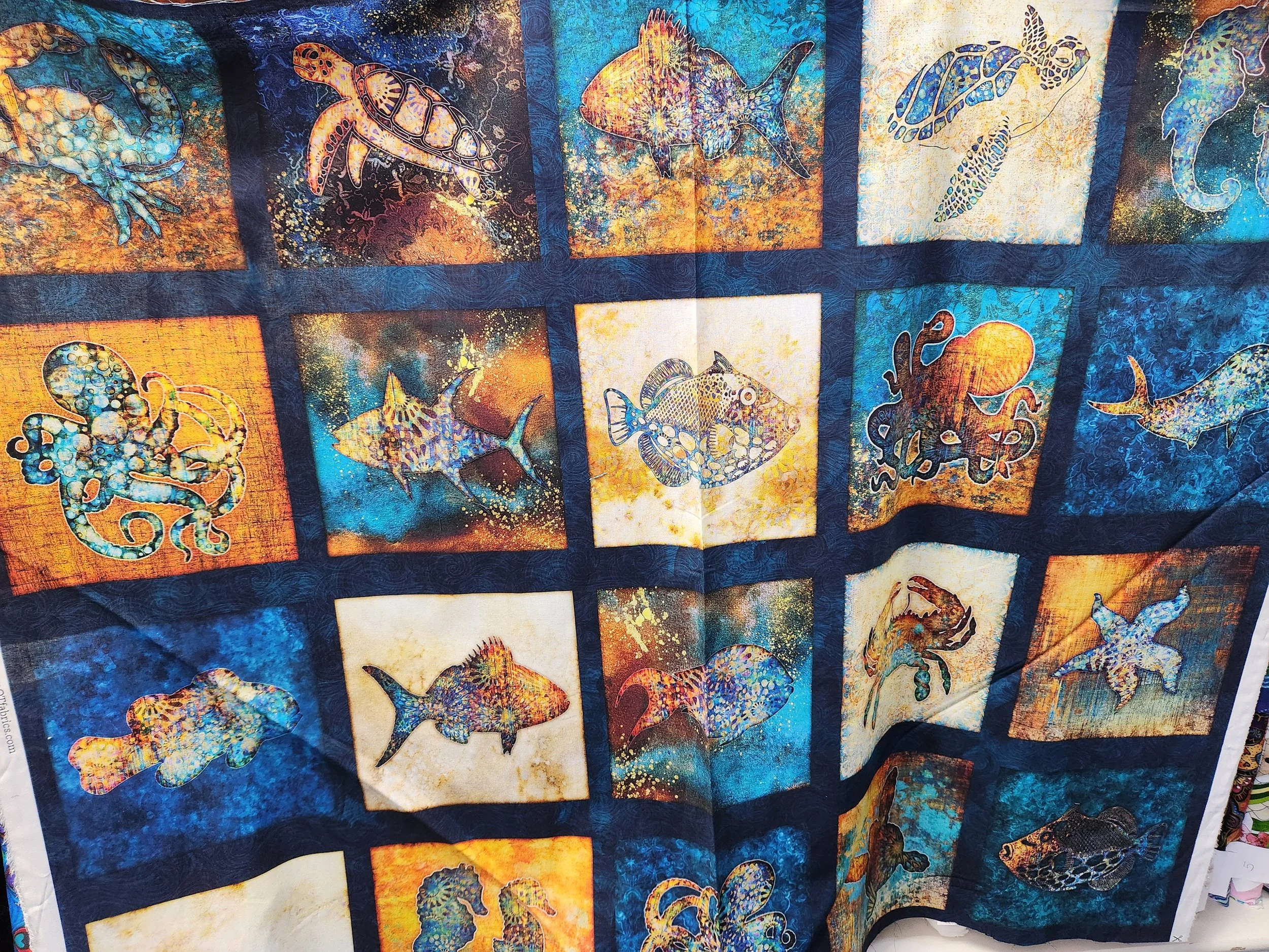 QT Fabrics Pacifica 2600-28816-n Artsy sea creatures in bright colors. 8 inch squares.  20 different squares in each repeat.