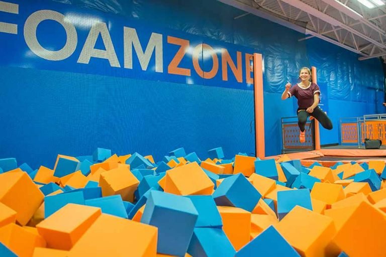 Kids jumping in the foam pit of Skyzone.