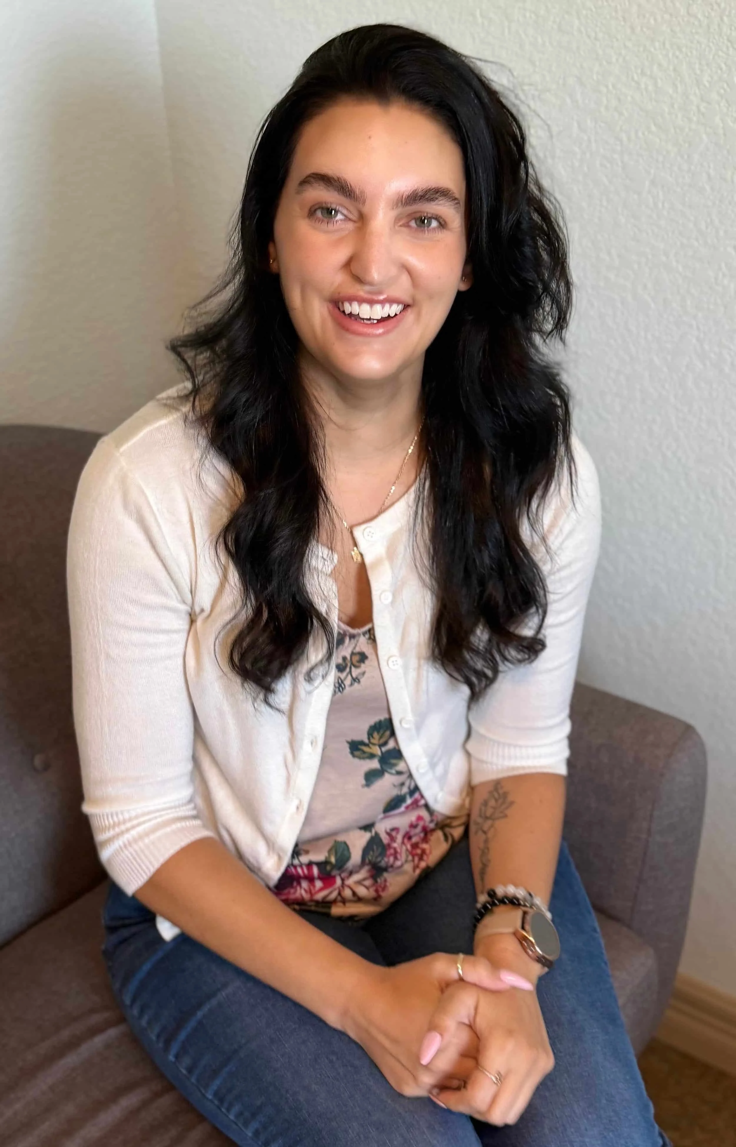 ATXMH therapist Amanda Griffith smiling in a relaxed stance in professional headshot