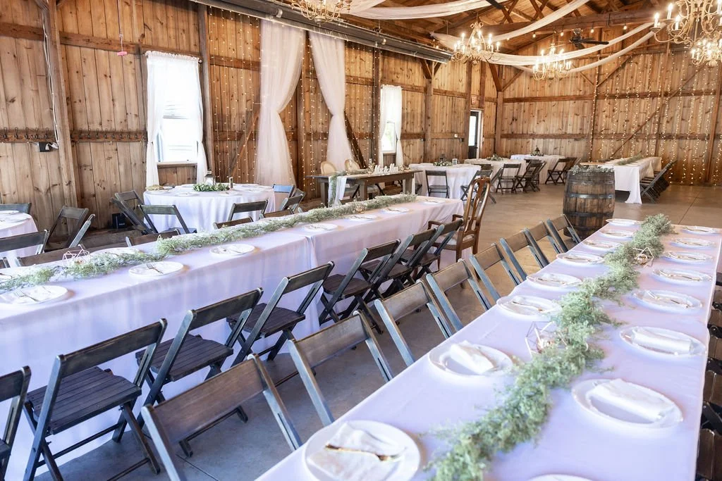 Guest tables at Lillian and Drew's wedding at Country Coach House in Burlington, IL.