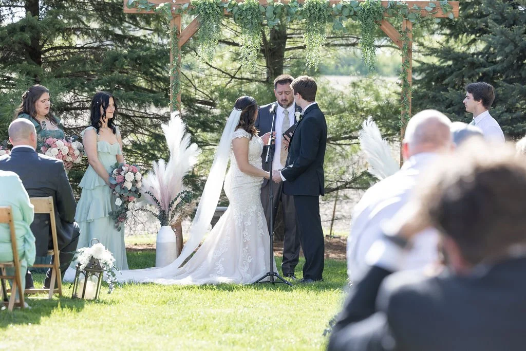 Outdoor wedding ceremony photo at Country Coach House wedding venue in Burlington, IL 