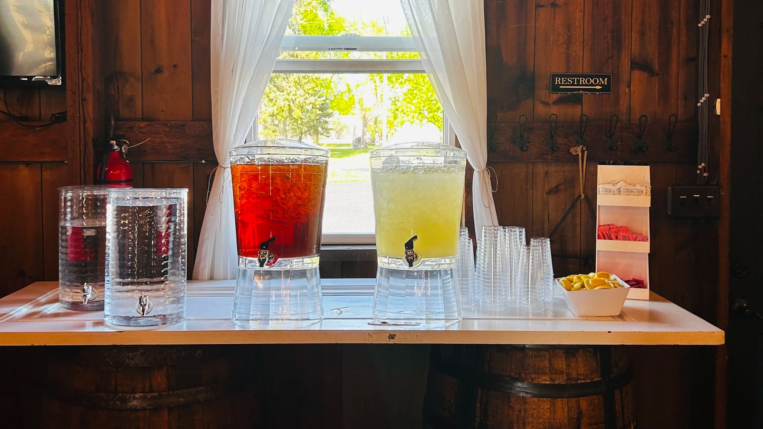 Tea and lemonade station by Uncle Bub's at Country Coach House wedding venue in Burlington, IL