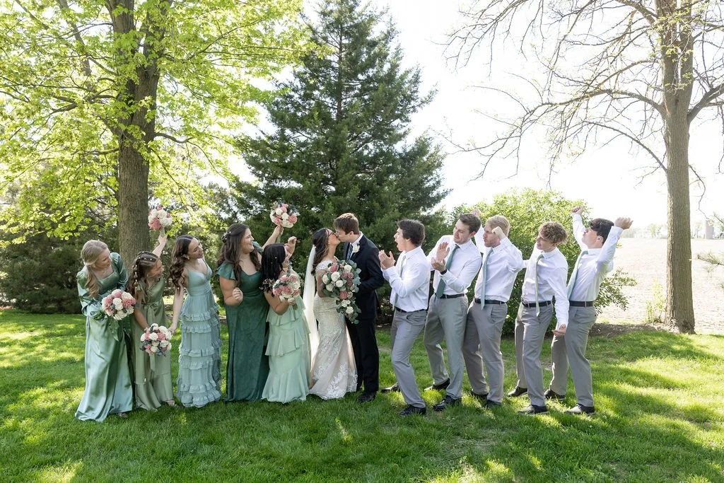 Couple and wedding party at Country Coach House wedding venue in Burlington, IL 