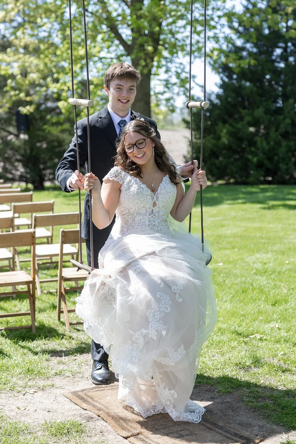 Couple on the tree swing at Country Coach House wedding venue in Burlington, IL 