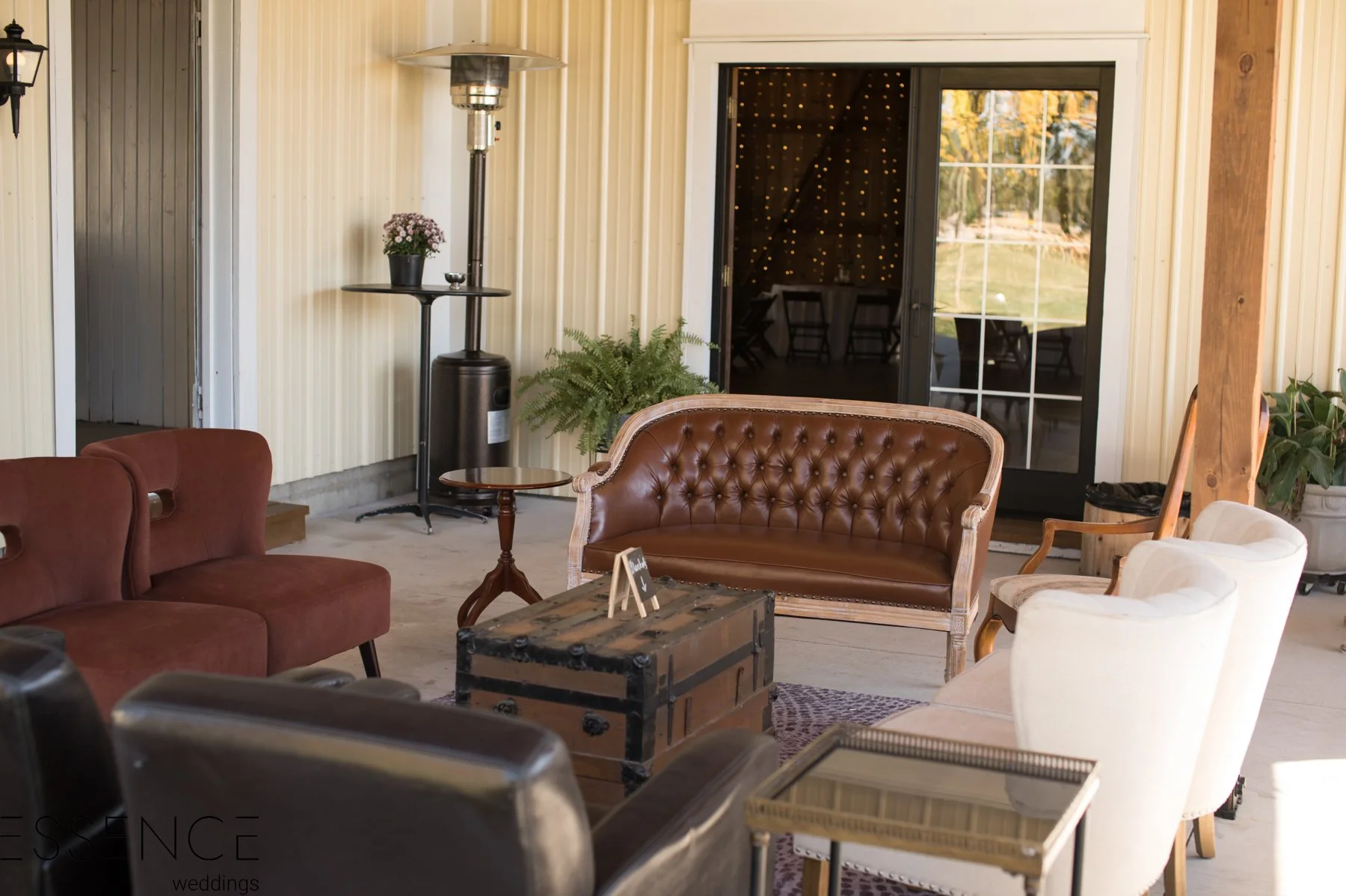 Lounge area setup on covered patio at Country Coach House in Burlington, IL.