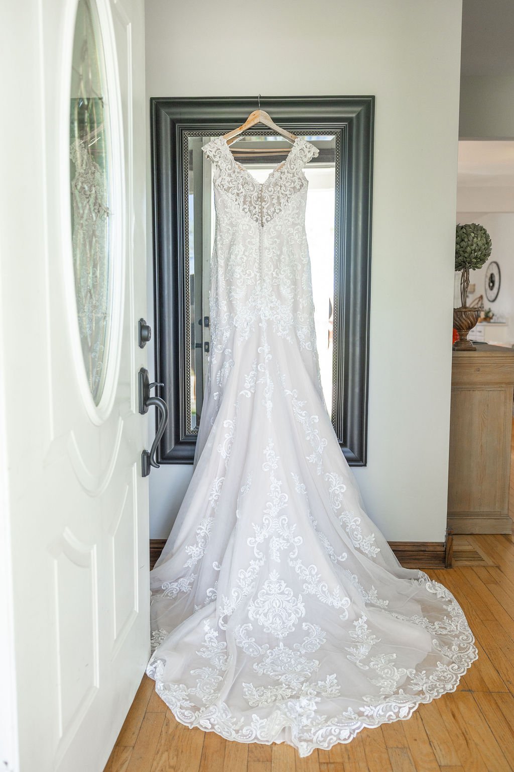 The wedding gown hanging at Country Coach House wedding venue in Burlington, IL 