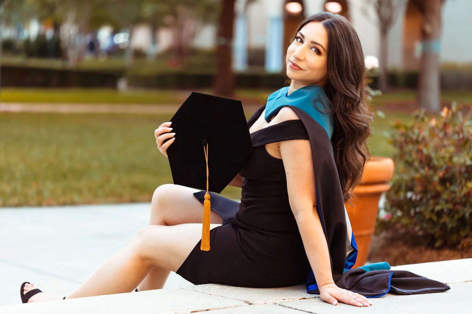 Graduate in cap and gown during a portrait session
