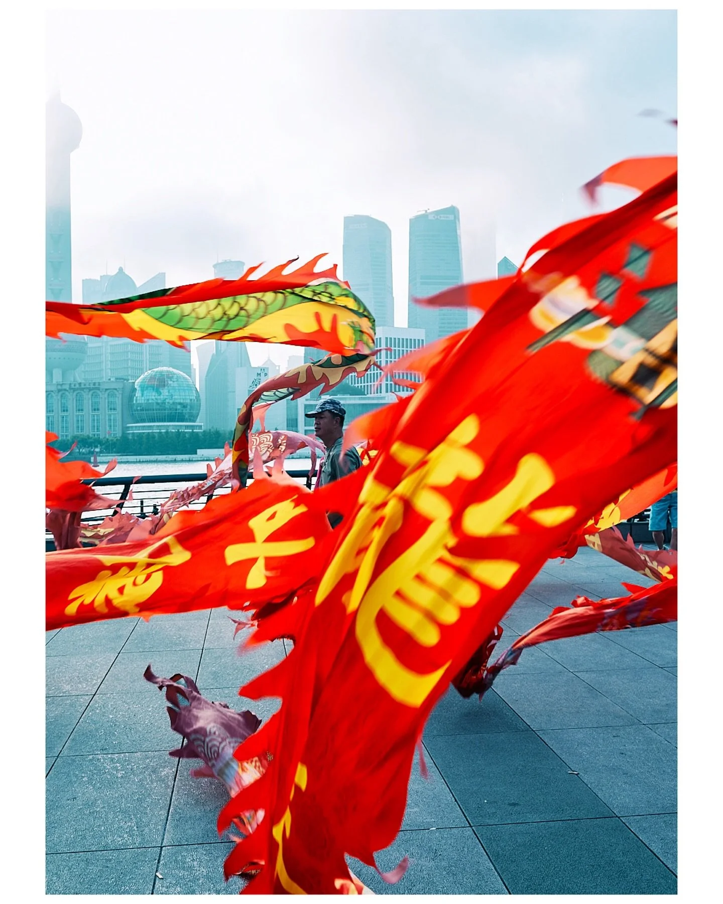 Early morning on the Bund ol skool locals practicing dragon dancing, kite flying or ribbon dancing. With the iconic Shanghai skyline as a backdrop. Super fun and welcoming crew. Loads of smiles energy was high. Was cool to watch. What a way to start 