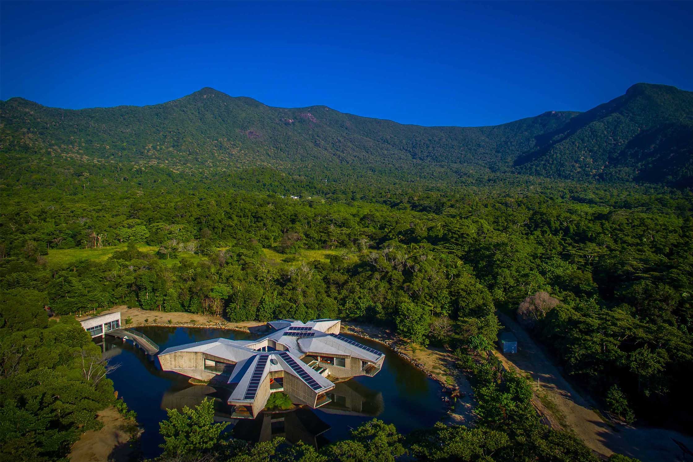 Alkira Resort House from a birdeye view - perched in a lake nestled in a rainforest in Northern Queensland, Australia