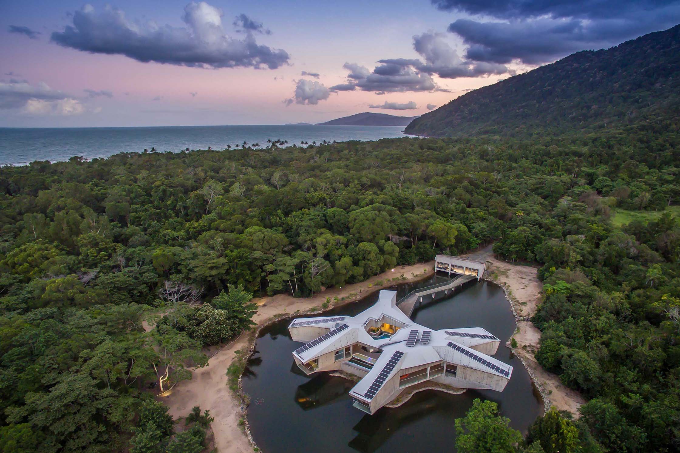 Alkira Resort House shown at sunset, with a view over Cape Tribulation