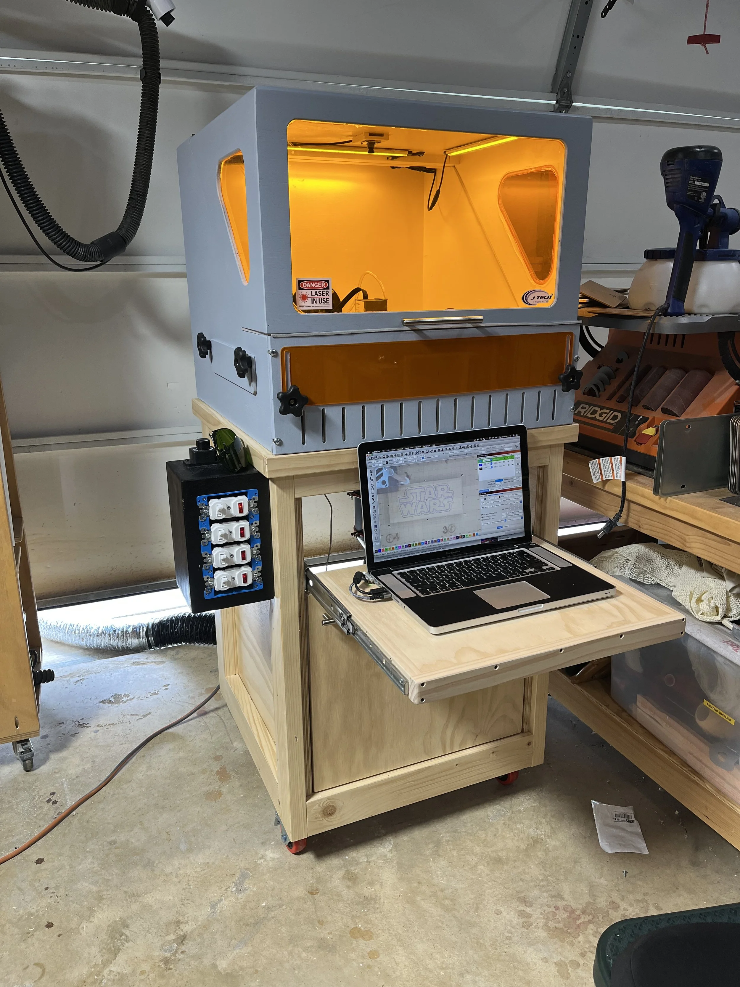 Enclosure and rolling cabinet for laser engraver. Built for my shop- Plans are available!