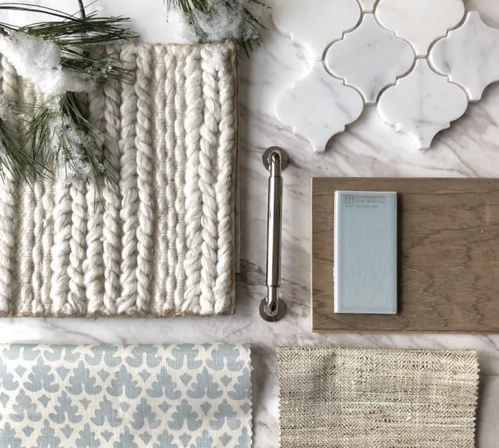 New fabrics, tiles, and hardware laid out.