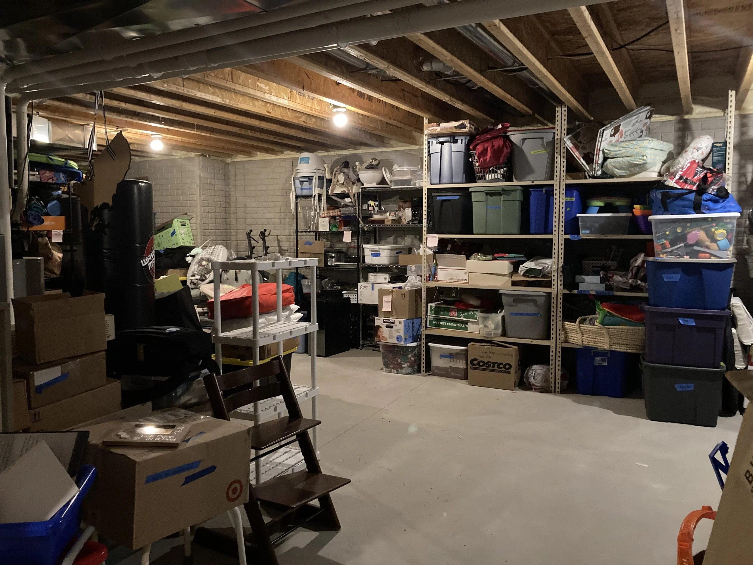 This is an after photo of a basement. We optimized the shelving and tote availability. Clients collected some items to be given or sold on the marketplace, and everything else is sorted by category into labeled bins.