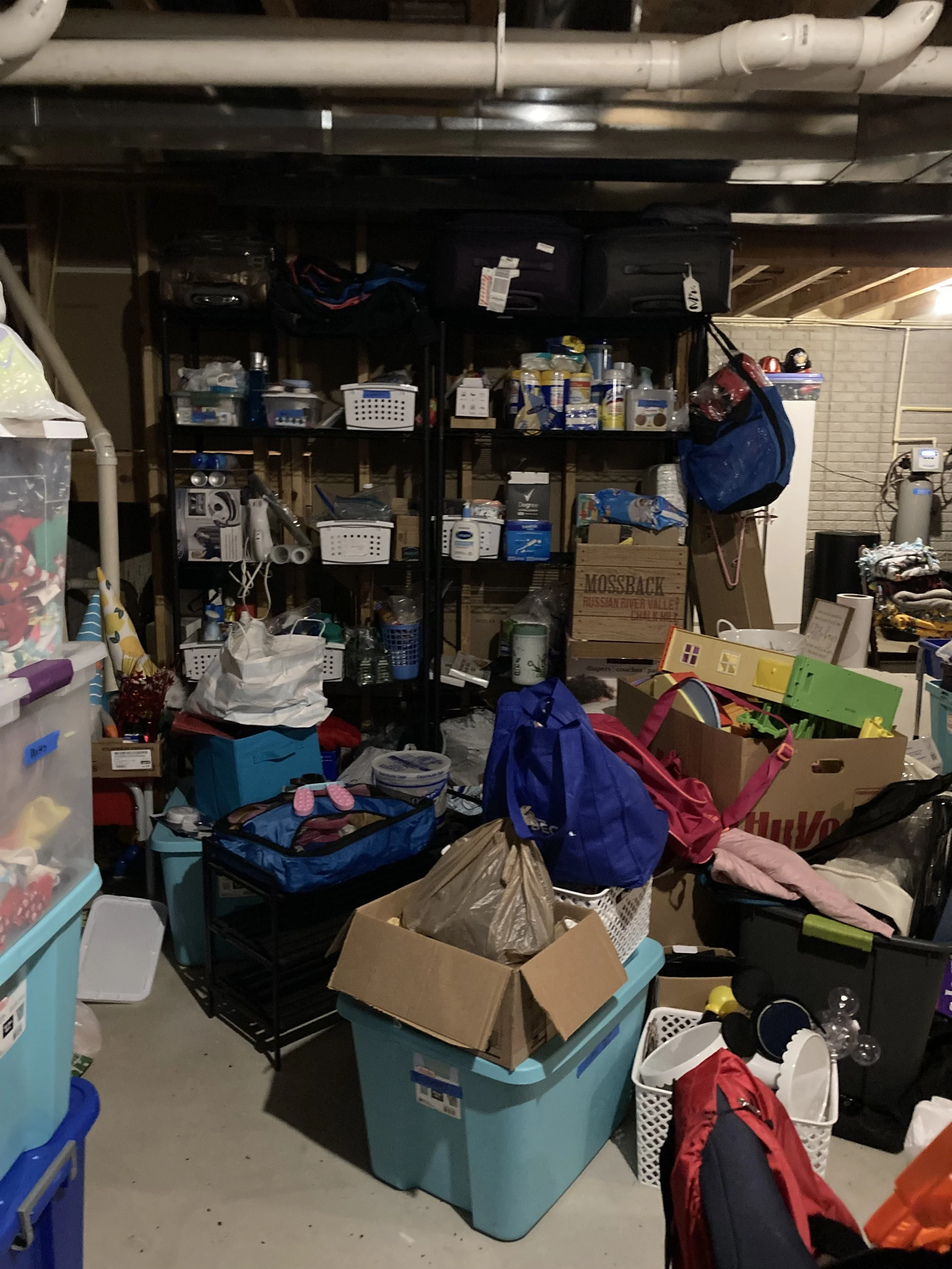 Before photo of cleaning supplies back stock.