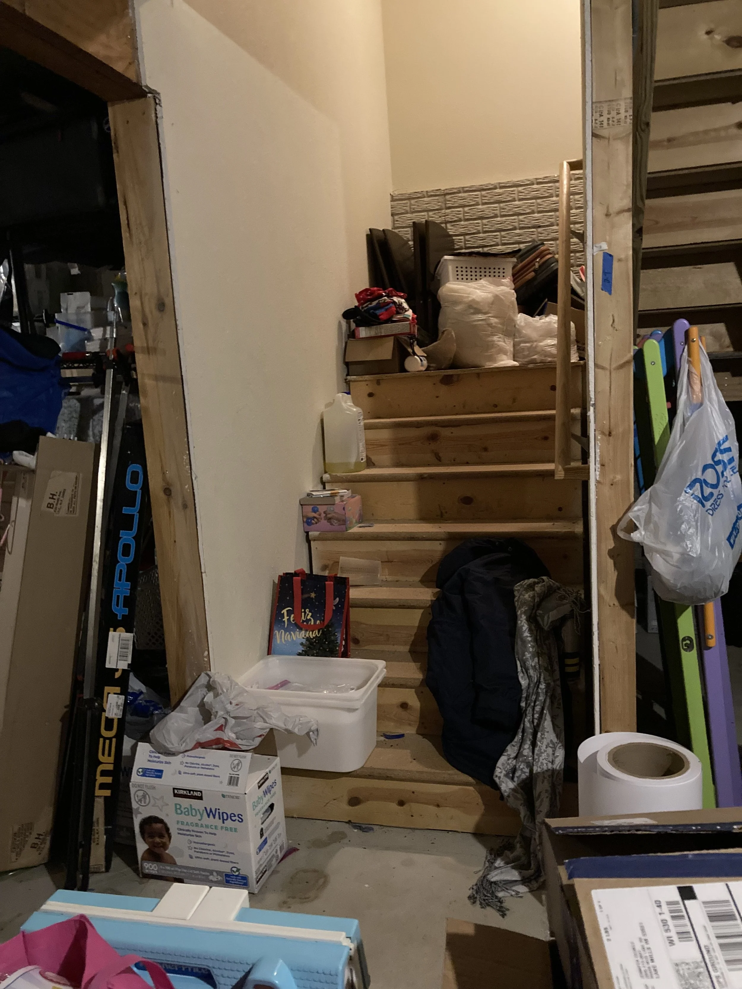 Before photo of basement stairs.