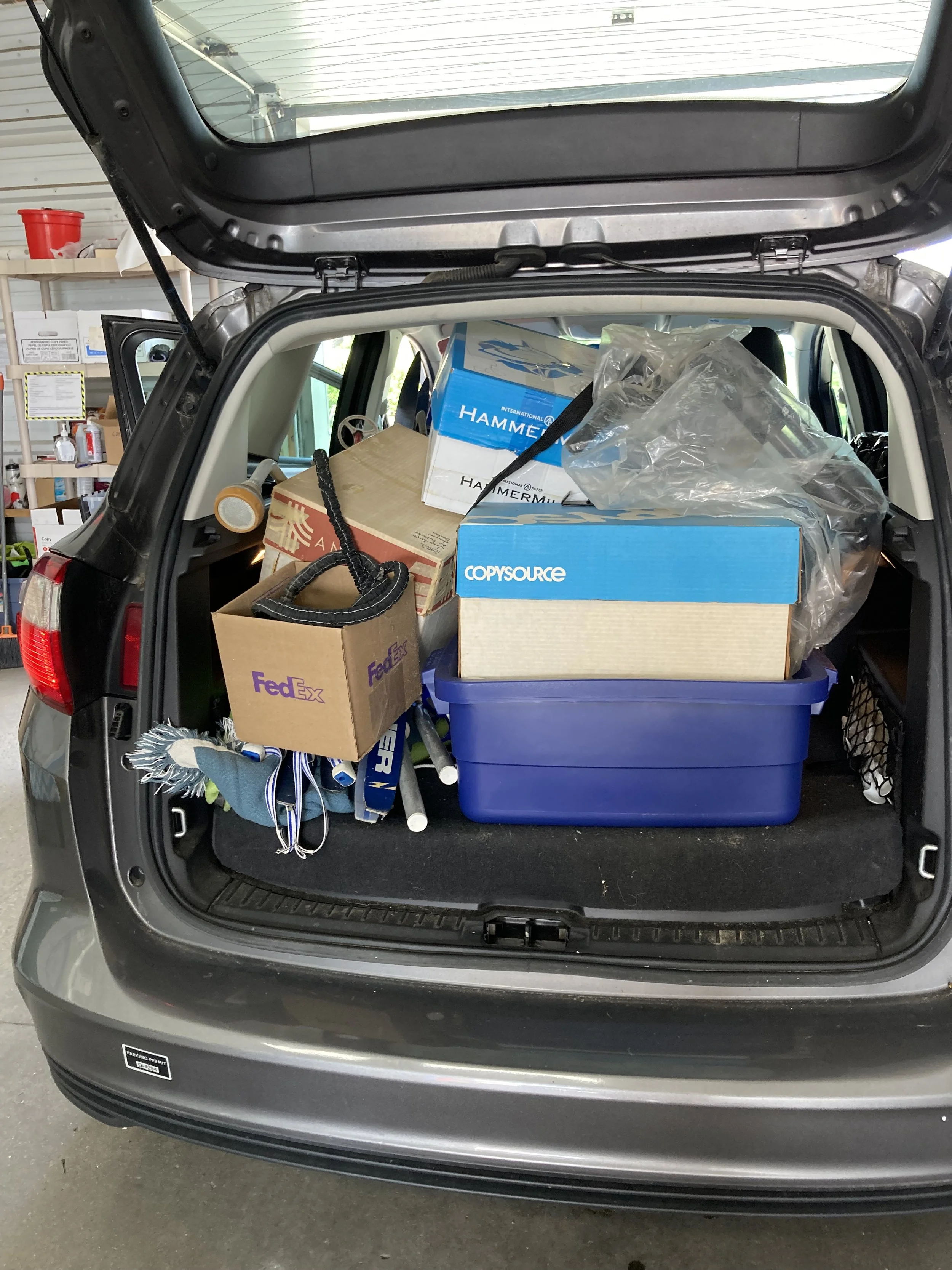 Photo of the car on the way for donation drop off. Many clients find this element of services to be essential.