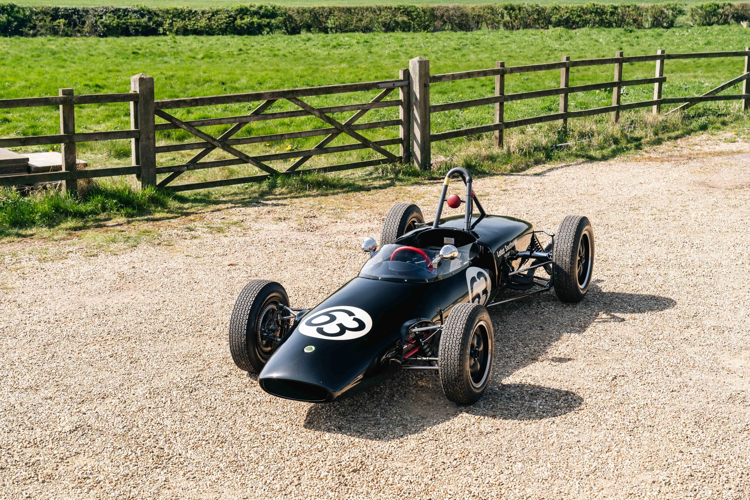 Lotus 20 Formula Junior – rear three-quarter view, chassis 20-J-905, black livery, drum brake configuration