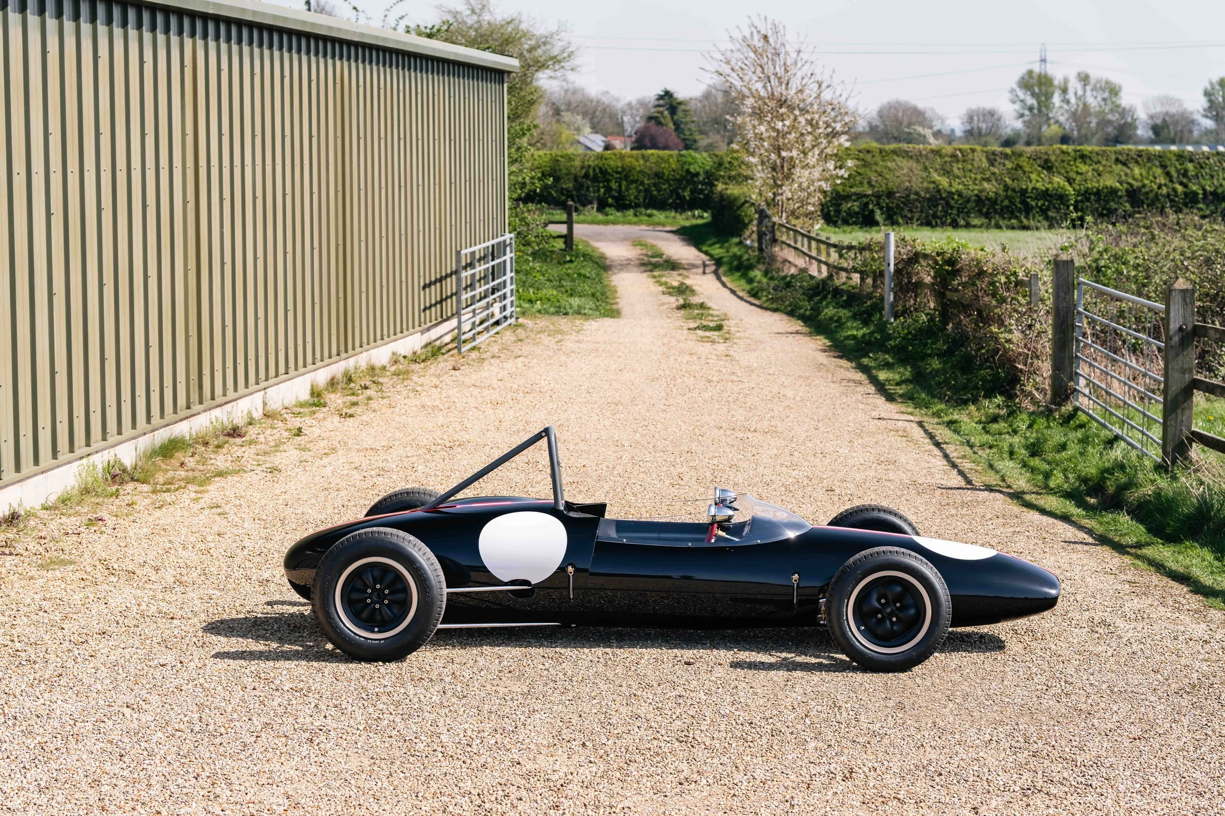 Lotus 22 Formula Junior – right profile, chassis 22-J-39, black livery with Austrian stripes, full length