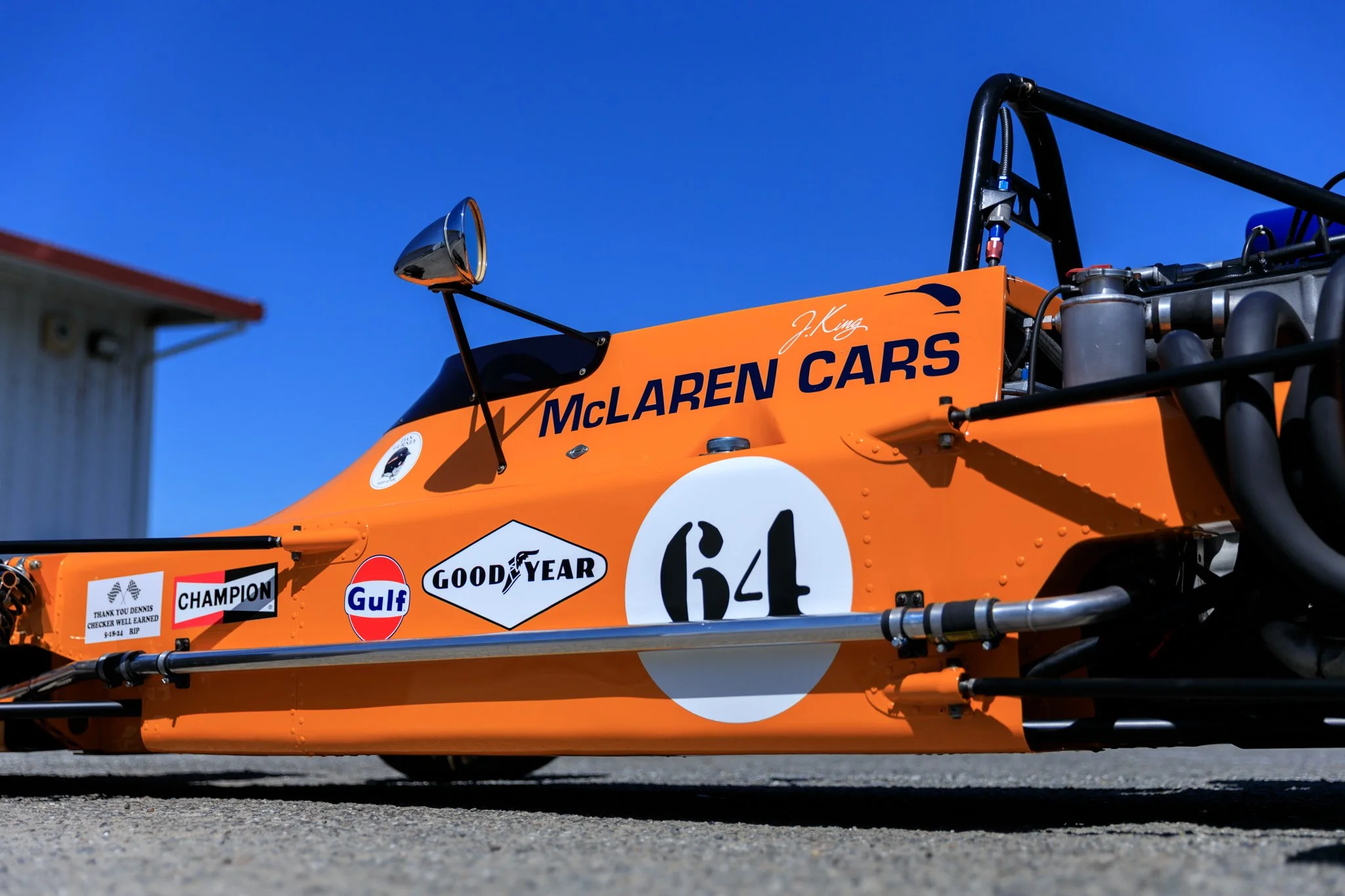McLaren M21 Formula 2, chassis M21-3 — left side three-quarter view, race number 64, McLaren Cars sidepod lettering, Gulf and Goodyear sponsor decals, James King signature