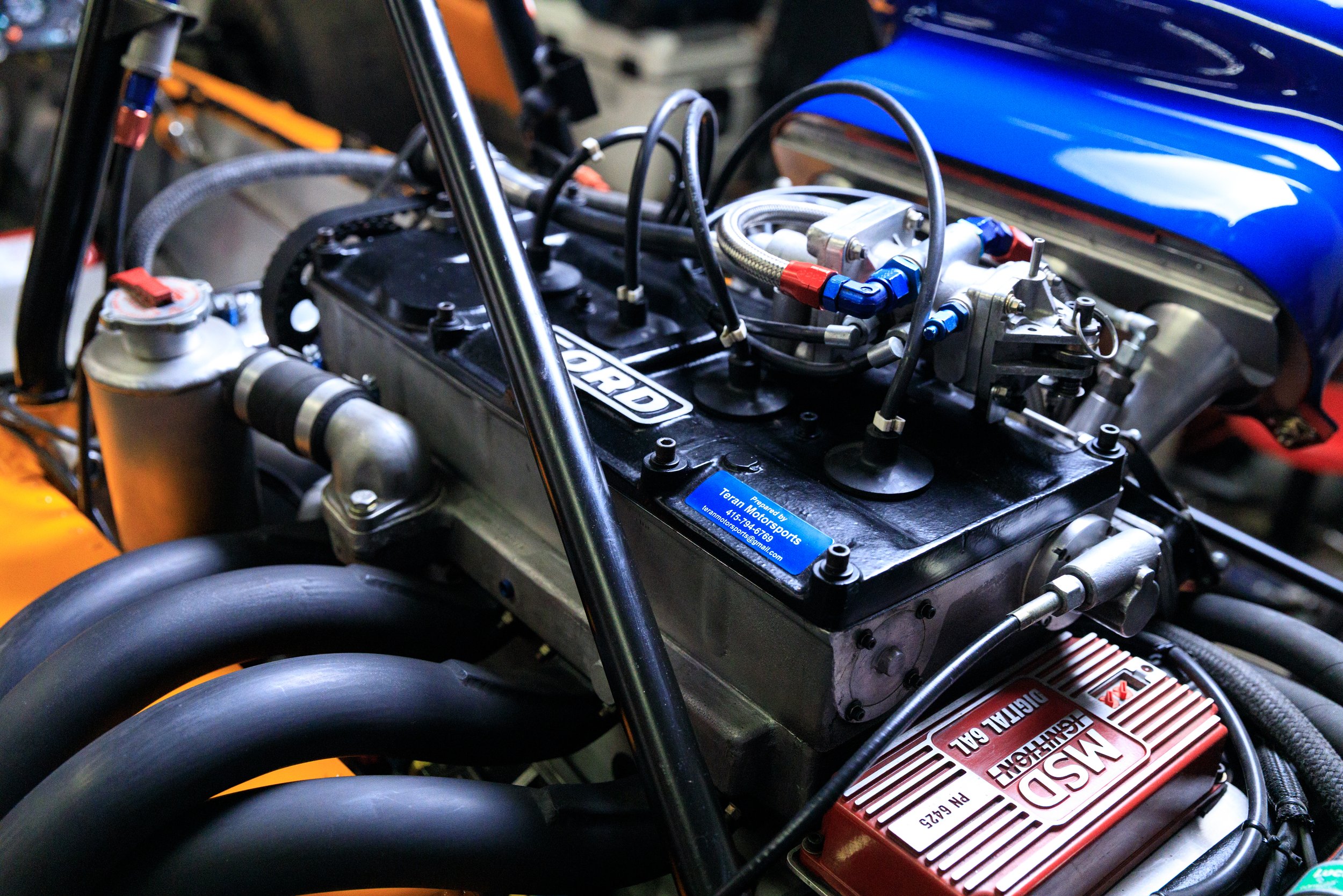 McLaren M21 Formula 2, chassis M21-3 — engine and ancillary detail, fuel system components, Papaya Orange chassis