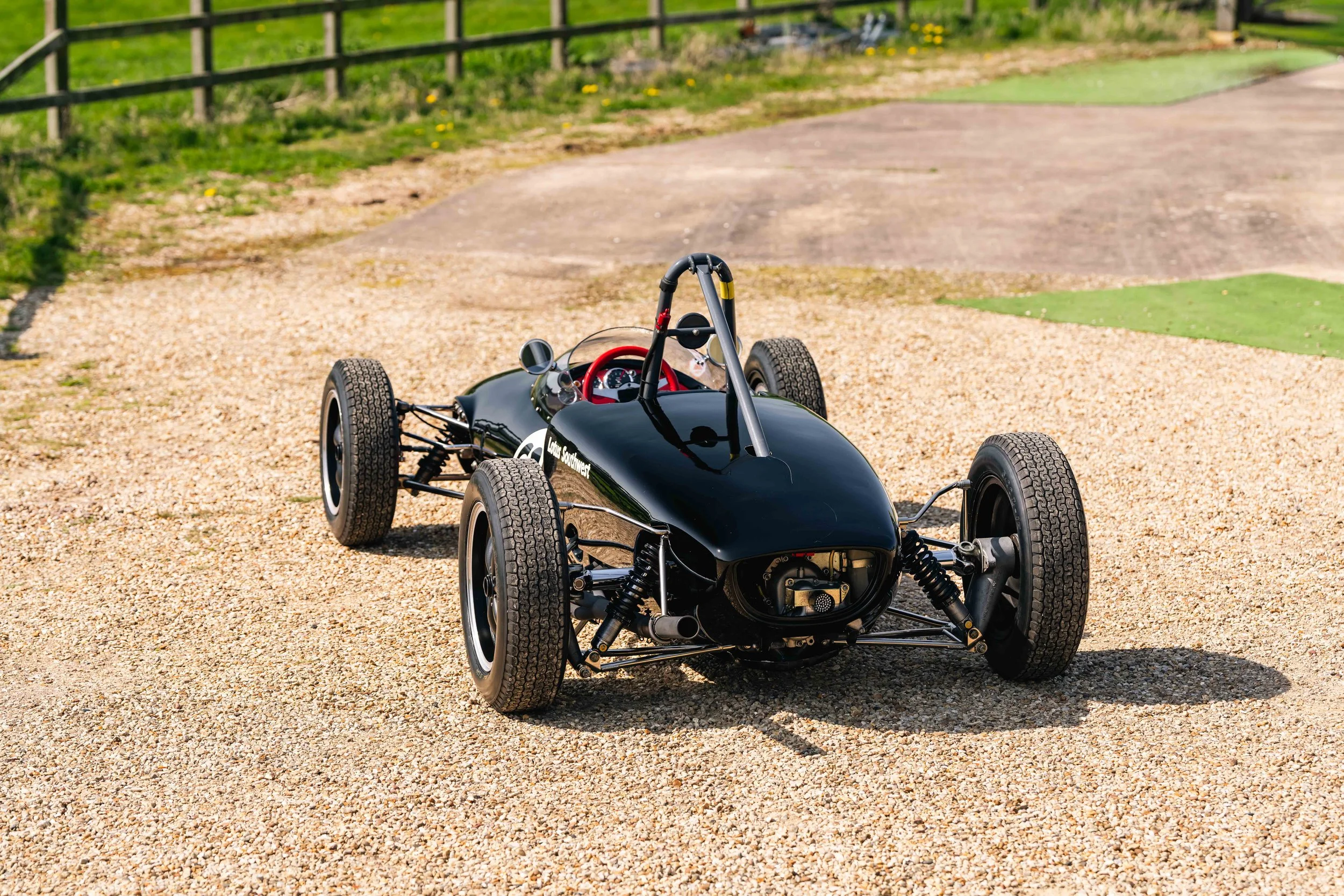 Lotus 20 Formula Junior – rear three-quarter view, chassis 20-J-905, black livery, drum brake configuration