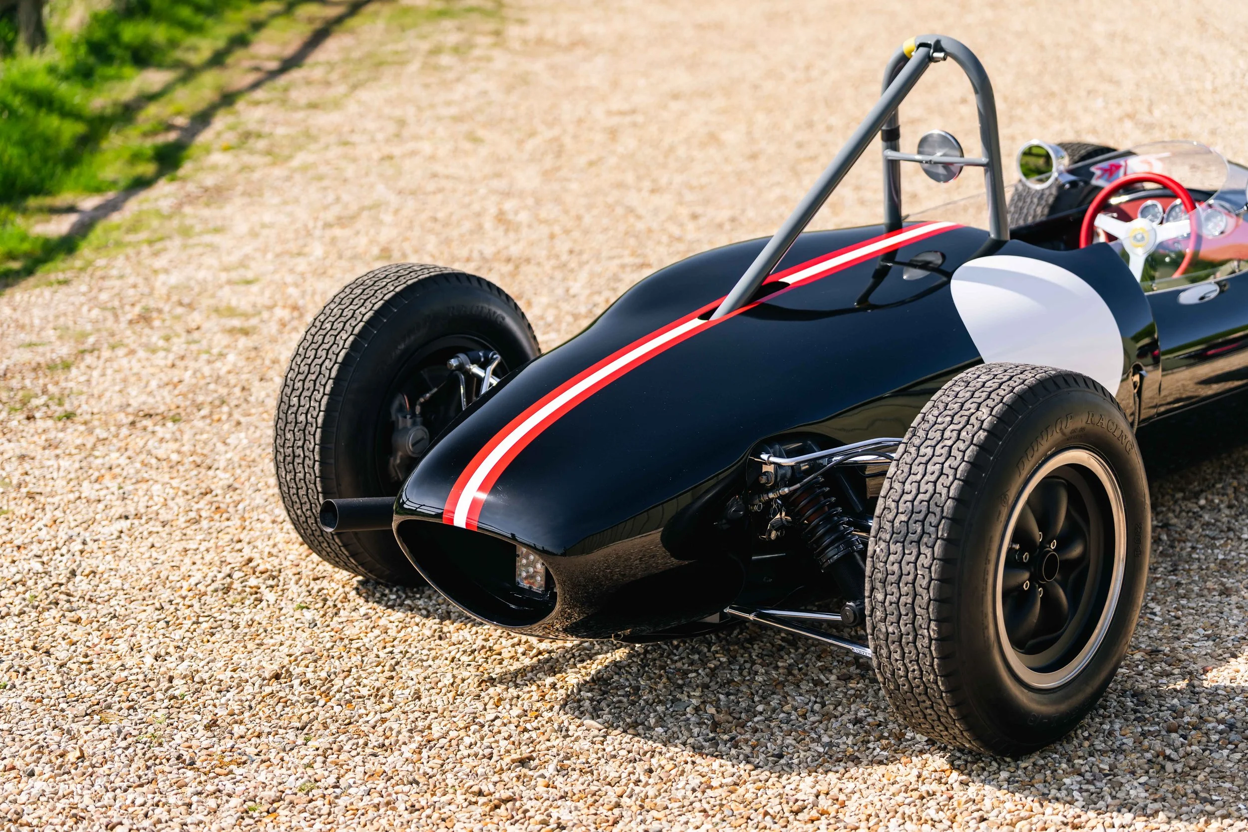 Lotus 22 Formula Junior – right side rear three-quarter, chassis 22-J-39, black livery with Austrian stripes