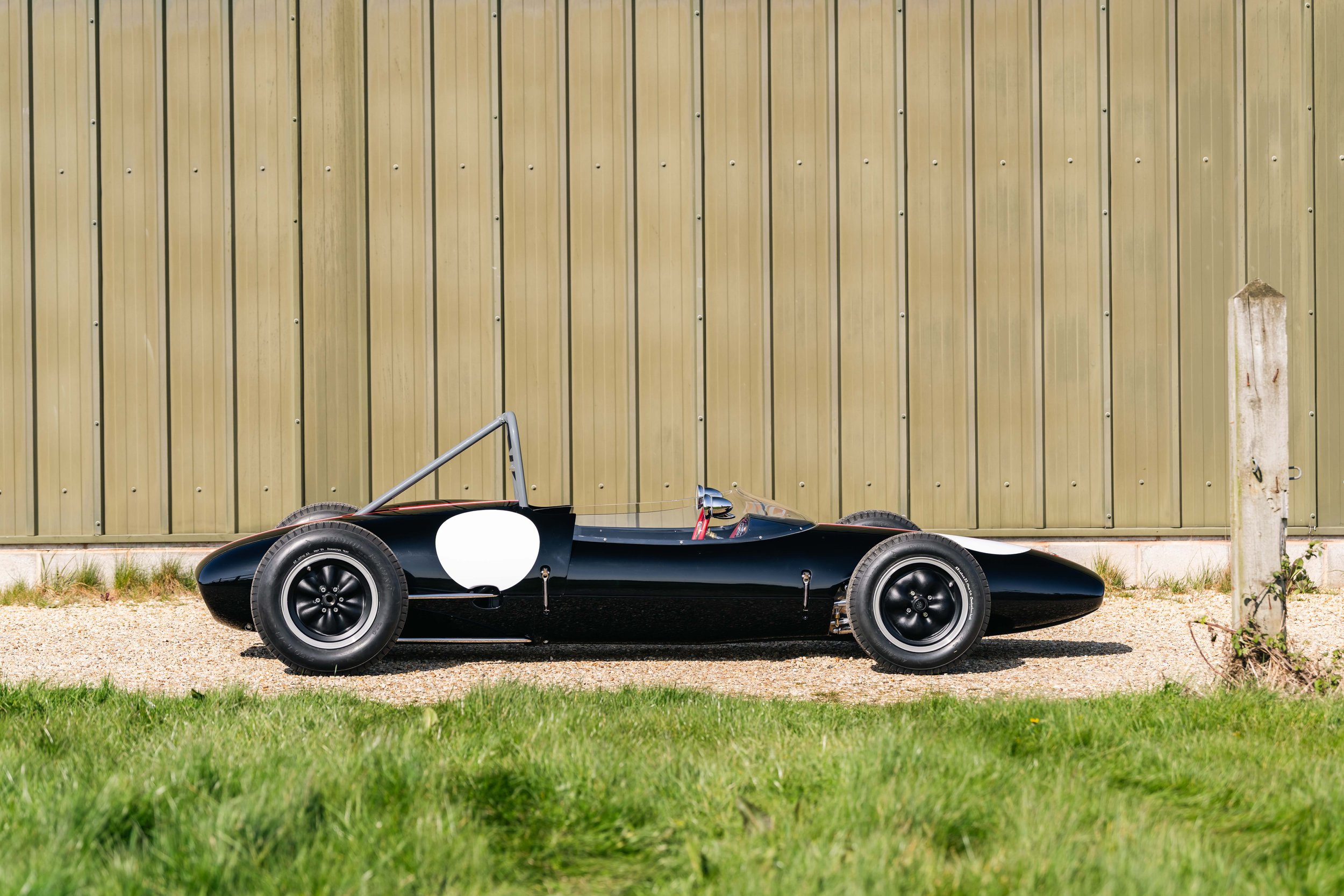 Lotus 22 Formula Junior – right profile, chassis 22-J-39, black livery with Austrian stripes, roll hoop and bodywork