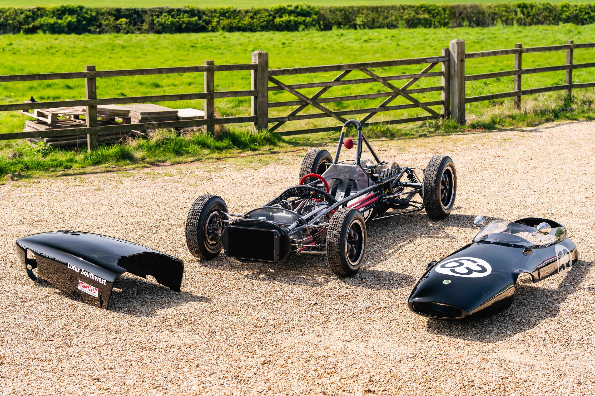 Lotus 20 Formula Junior – rear three-quarter low angle, chassis 20-J-905, black livery, bodywork removed