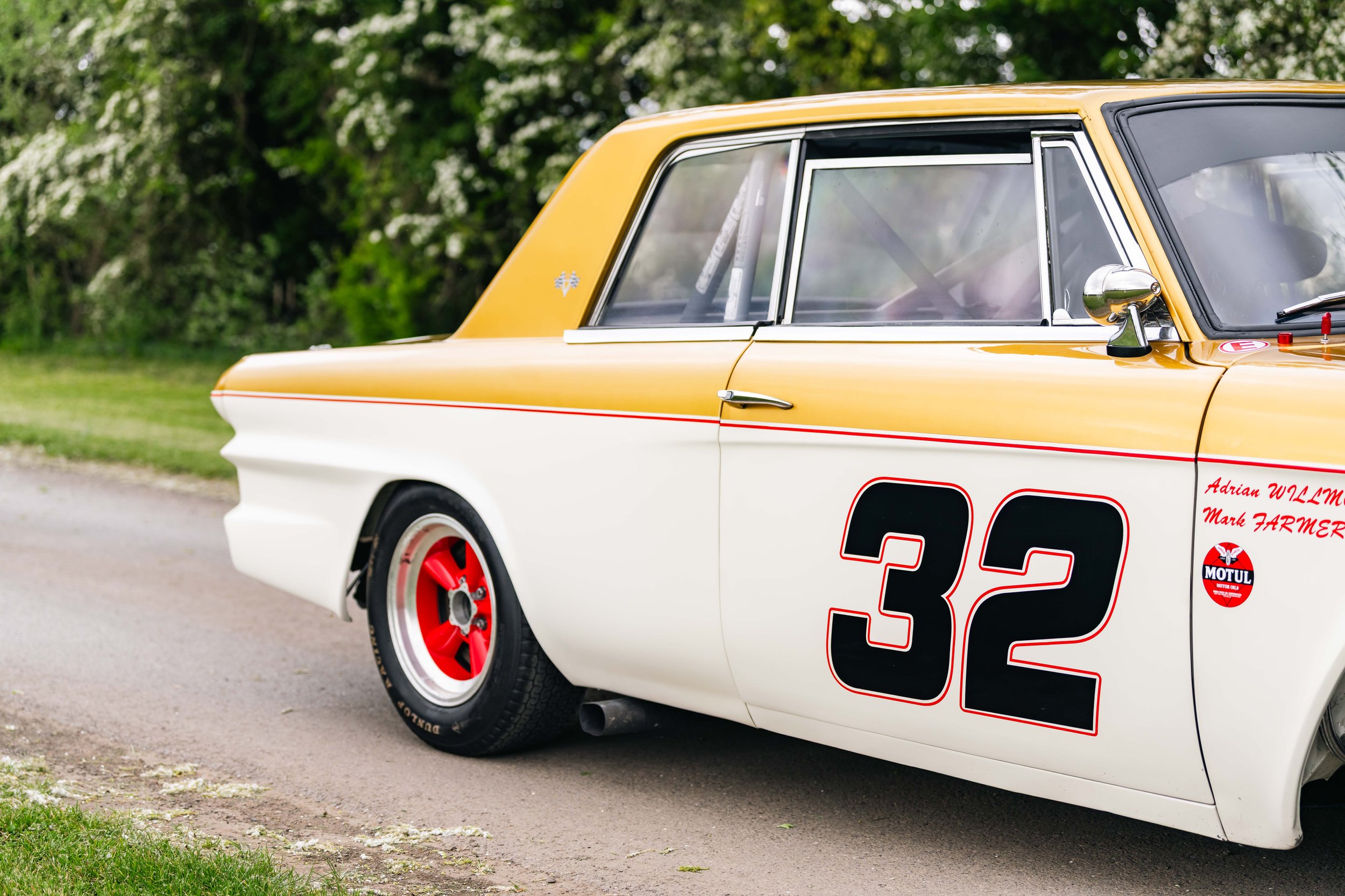 Studebaker Lark Daytona historic touring car. Goodwood. white and gold livery. number 32.