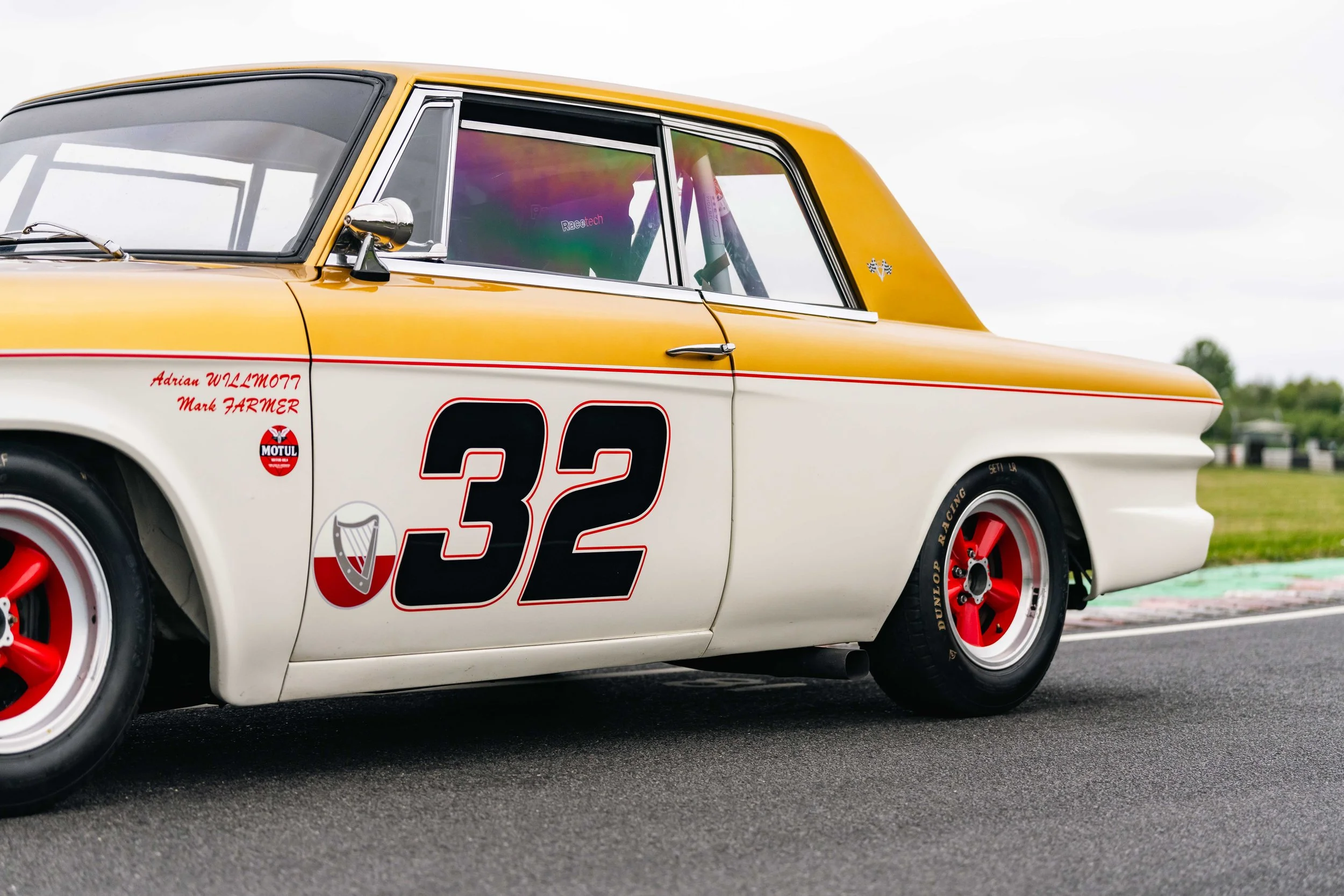 Studebaker Lark Daytona historic touring car. Goodwood. white and gold livery.