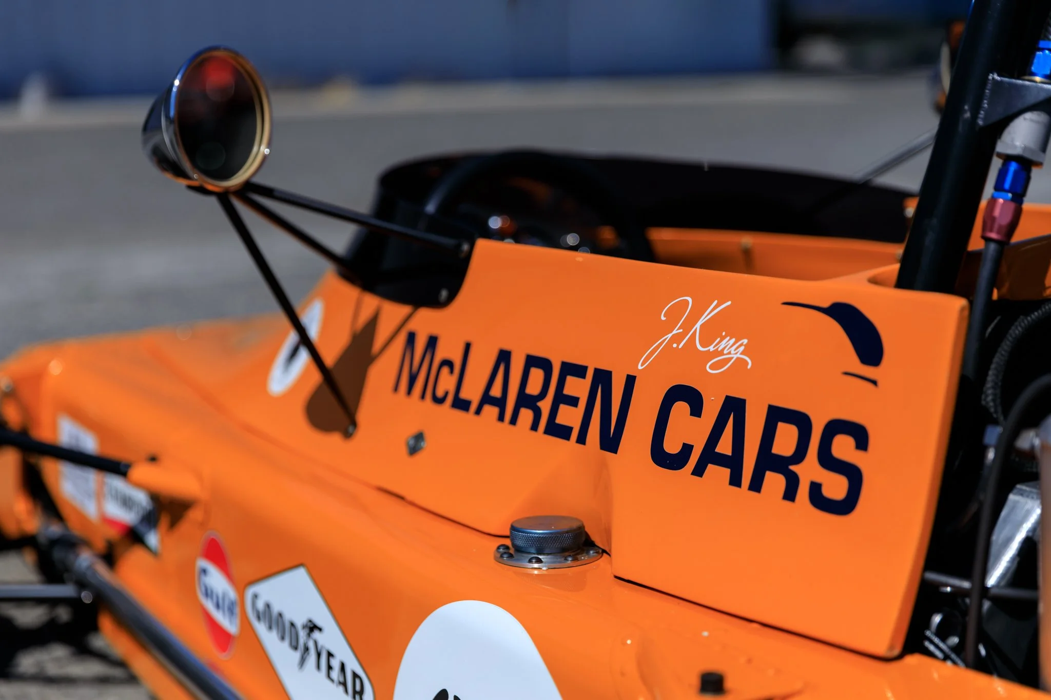 McLaren M21 Formula 2, chassis M21-3 — close detail of left sidepod, McLaren Cars lettering, James King signature, Gulf sponsor decal