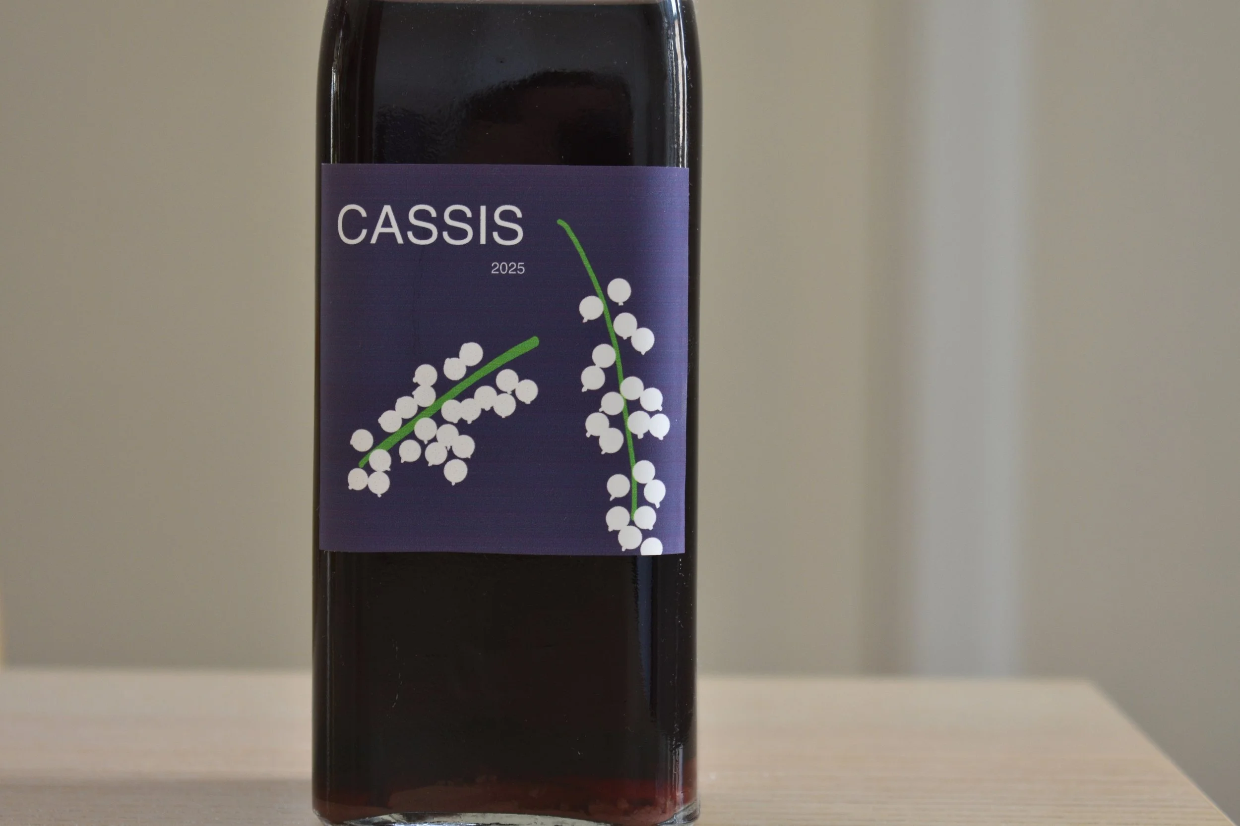 A bottle of cassis liqueur