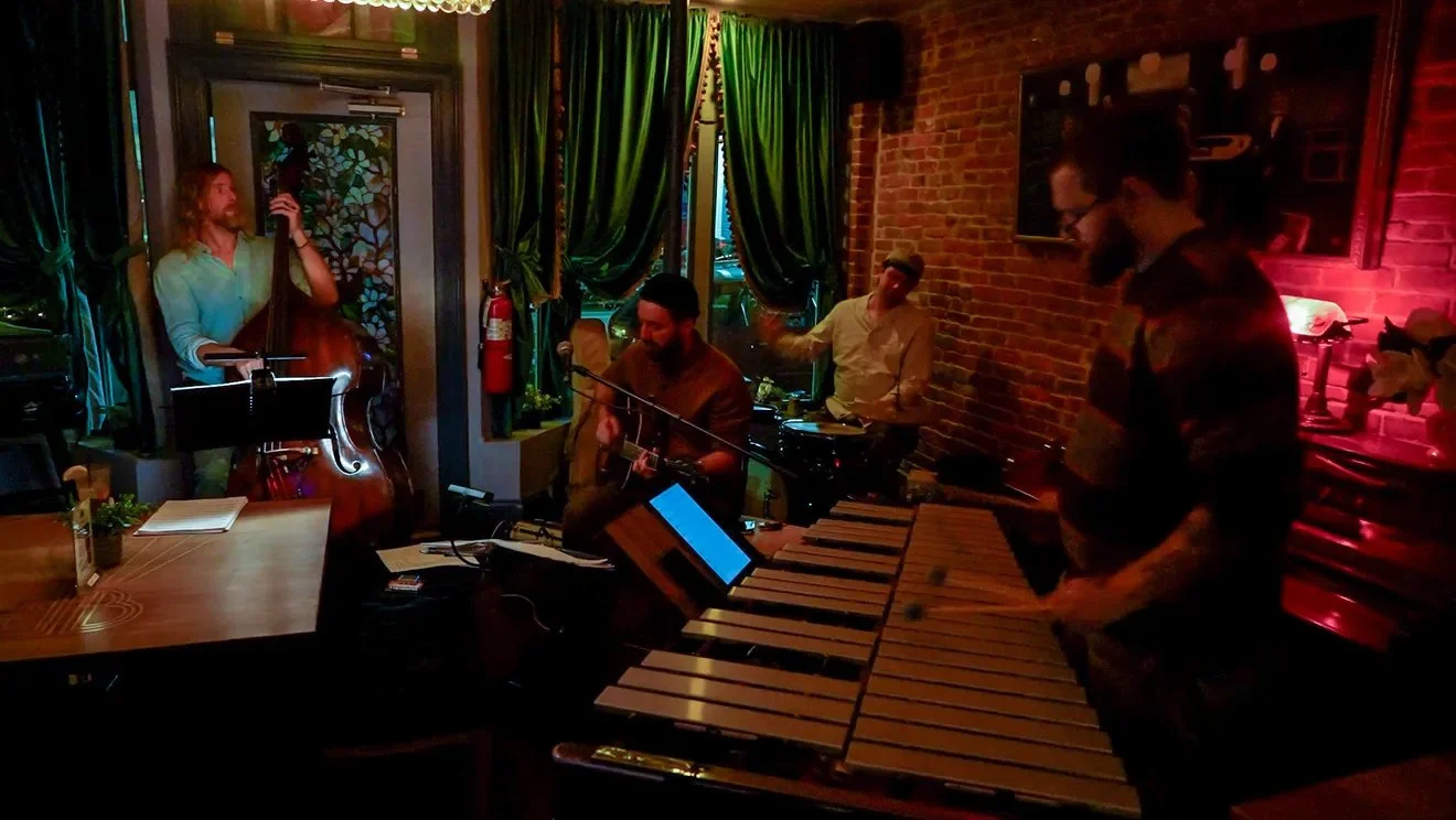 A jazz quartet plays at the Royal Bobcat in Providence, RI--featuring upright bass, vibraphone, electric guitar and drums.