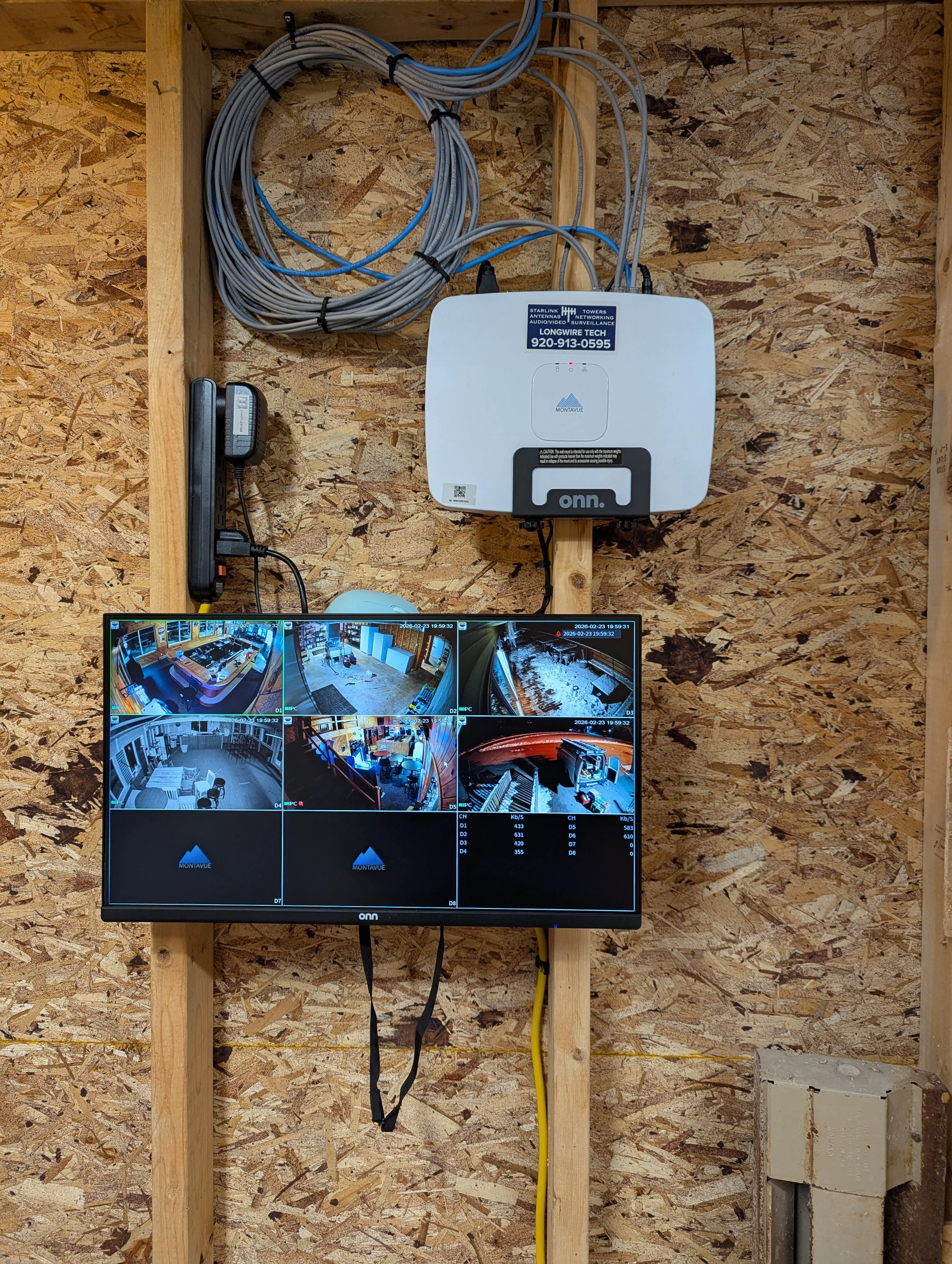 Residential security camera system installation with monitor setup in Oshkosh home